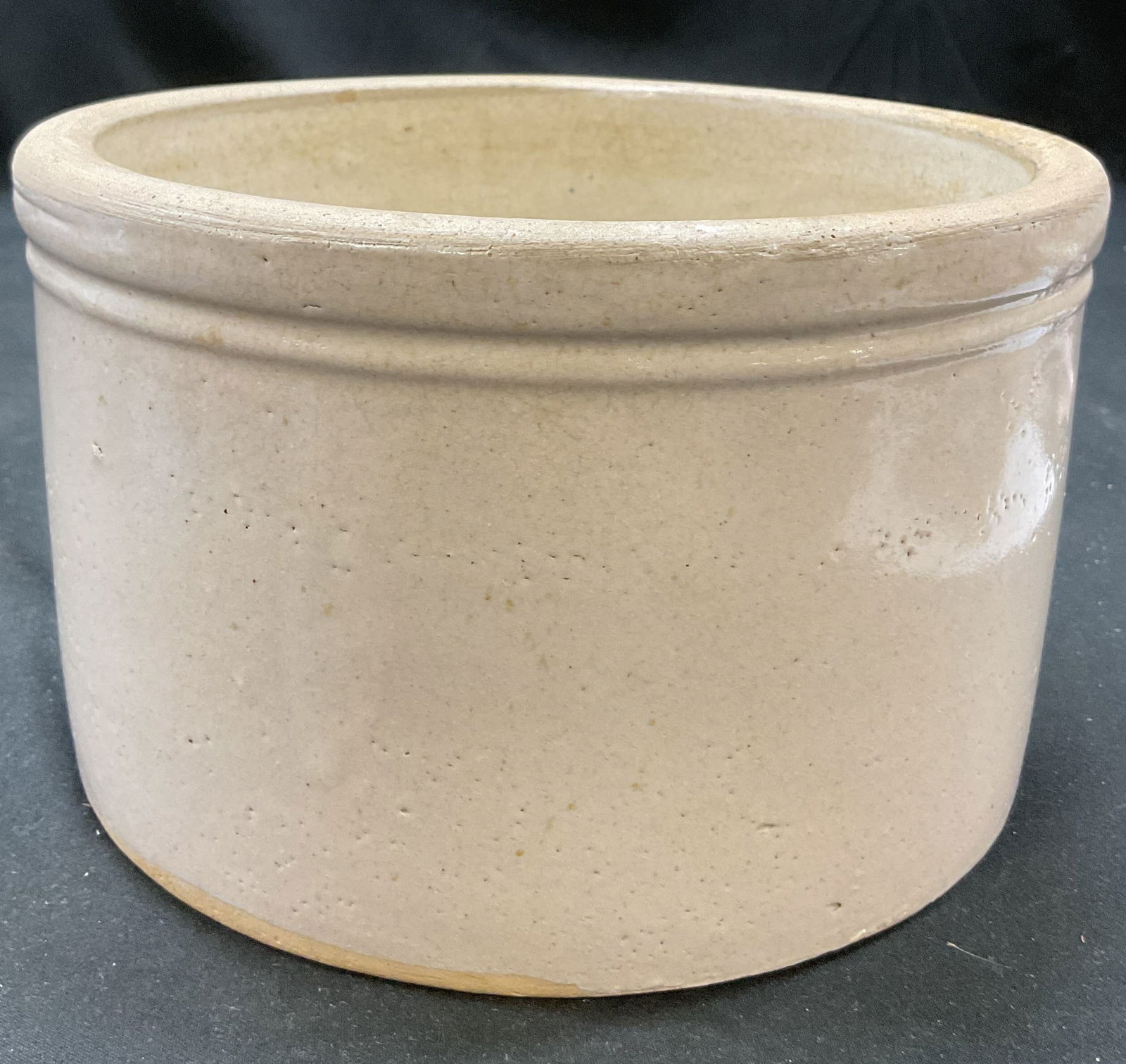 Vintage Stoneware Cream Colored Pottery Crock: Vintage stoneware cream colored pottery crock. Solid cream colored crock pot. Measures 4.5 x 7.25 inches. Some surface wear consistent with exposure. 3 1/2 written on underside. Stoneware, crock pot,