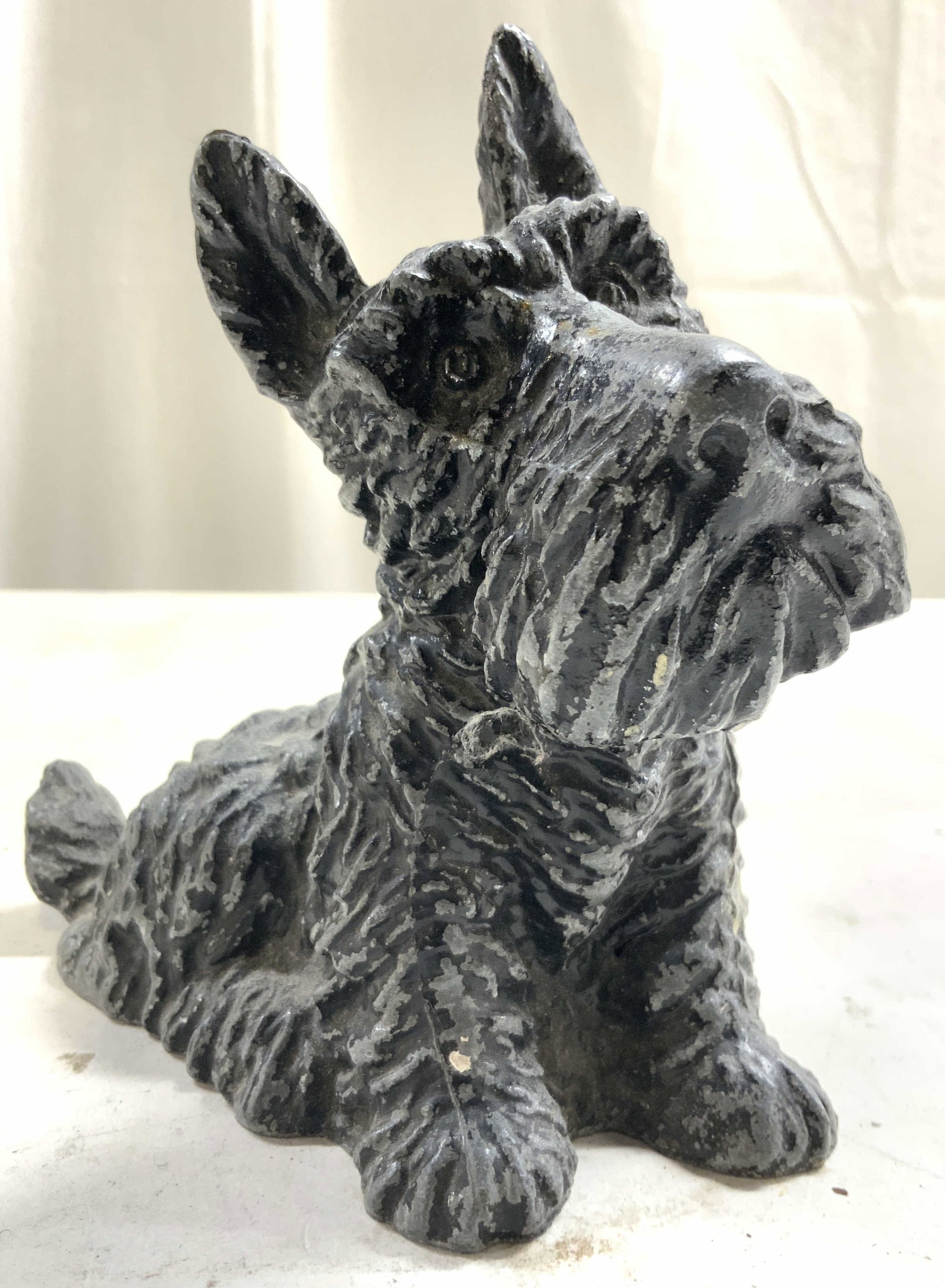 Vtg Metal Scotty Dog Scottish Terrier Coin Bank: Coin bank is Vintage. Piece is black & slate toned. Coin bank is metal. Piece is in the form of a seated Scottish Terrier dog. Underside has opening to interior. Piece measures approximately 6 inches 