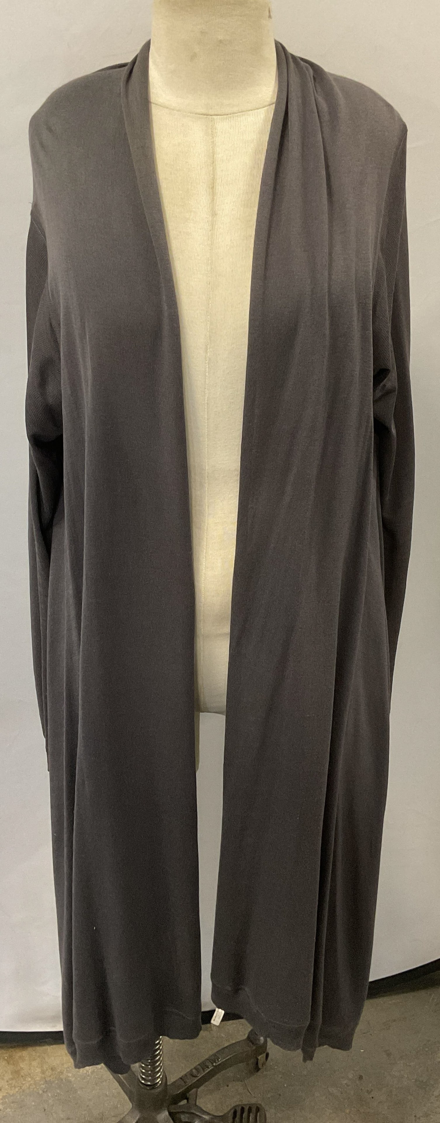 DKNY Grey Asymmetric Cardigan Sweater: DKNY grey asymmetric hem open cardigan sweater. Size medium/large. Synthetic material. Gently worn. DKNY sweater, DKNY cardigan, designer sweater, designer cardigan, grey sweater, grey cardigan, 10 h