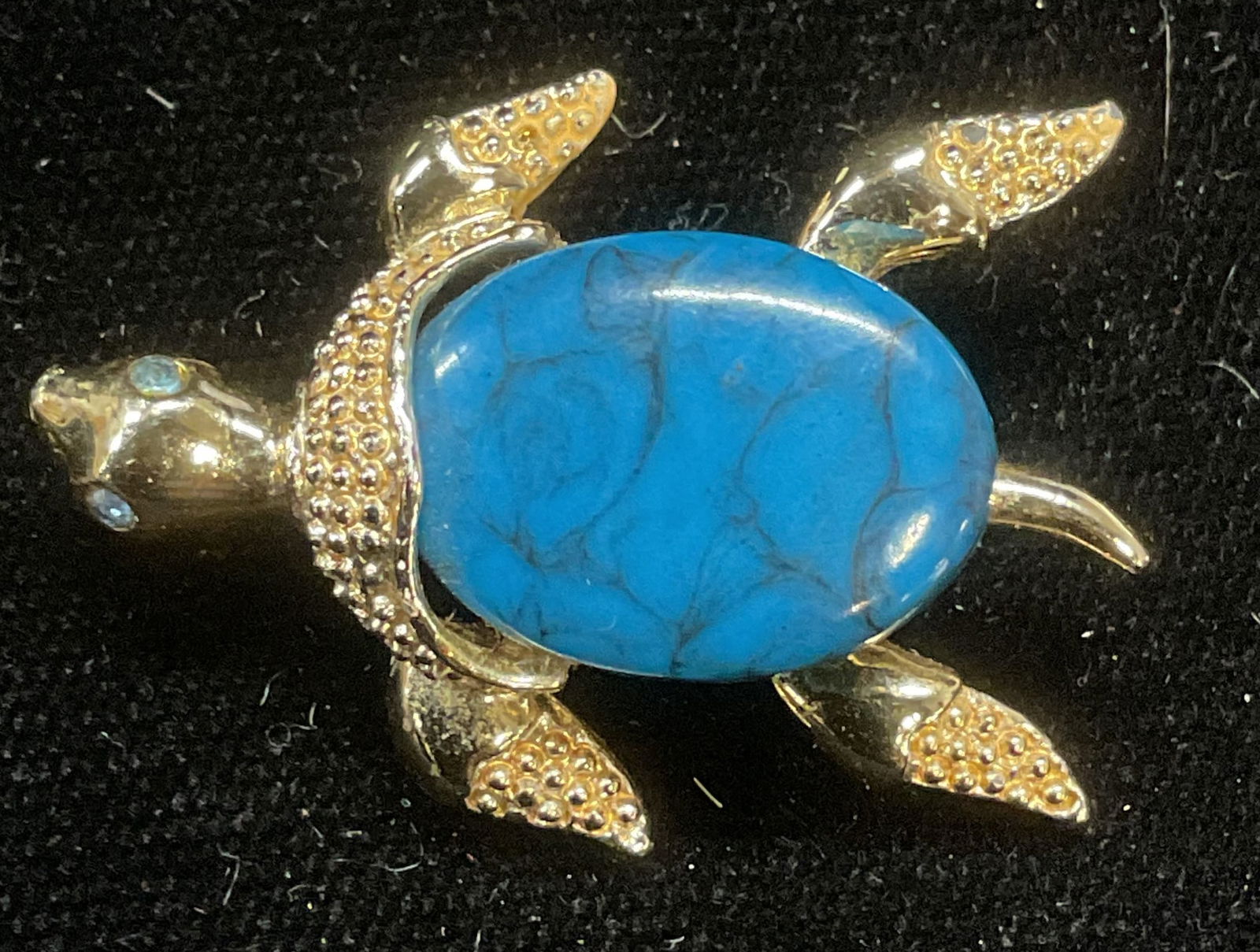 Gerrys Blue Lucite Cabochon Turtle Brooch: Vintage Gerrys gold tone turtle motif brooch with blue lucite cabochon. Signed. Measures approx 1.25 x 1 inches. Some wear including scratching. Jewelry, estate jewelry, costume jewelry, cocktail jewe