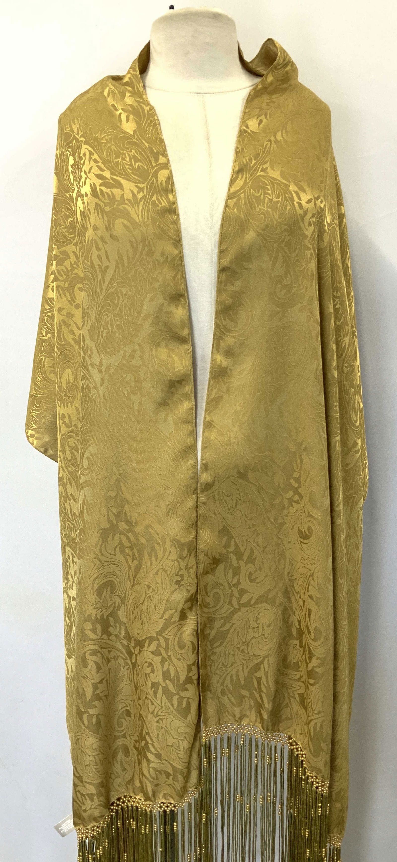 Echo Gold Floral Embell. Beaded Fringe Shawl INDIA: Echo Gold Floral Embellished Beaded Fringe Shawl INDIA Shawl features a gold toned color & floral pattern. Ends of shawl has embellished beaded fringes. Signed & marked. Reads, ECHO & MADE IN INDIA. S