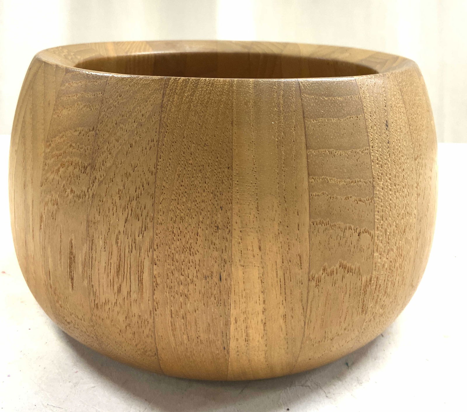 DANSK INTERNATIONAL MCM Tan Toned Teak Wood Bowl: Appears to be mid century circa 1960s, possibly designed by Quistgaard. Underside is inscribed Dansk International Designs LTD IHQ/Malaysia. Bowl is tan toned and wooden, possibly teak wood. DANSK sal