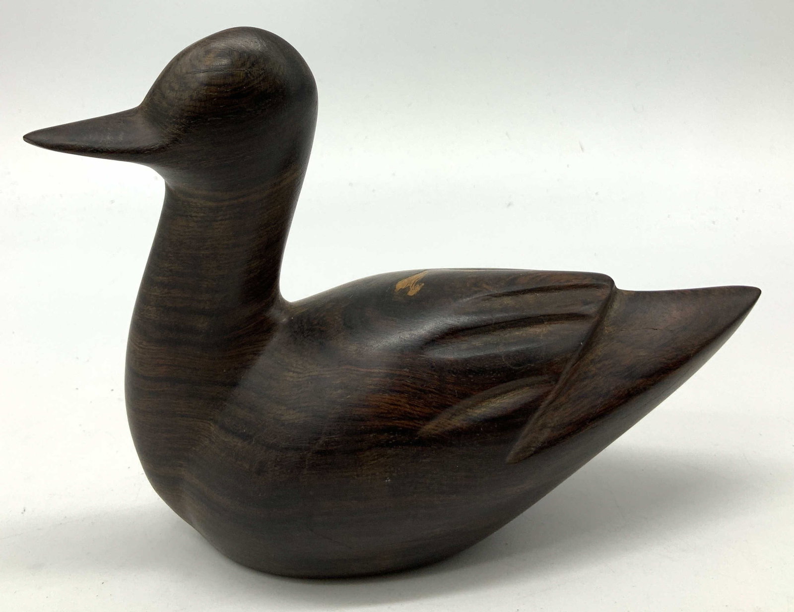 Vntg Folk Art Carved Ironwood Duck Figurine: Vntg Folk Art Carved Ironwood Duck Figurine Figurine depicting a hand-carved duck figurine. Duck appears to be ironwood material & has a polished finish. No visible signature or markings. Surface wear