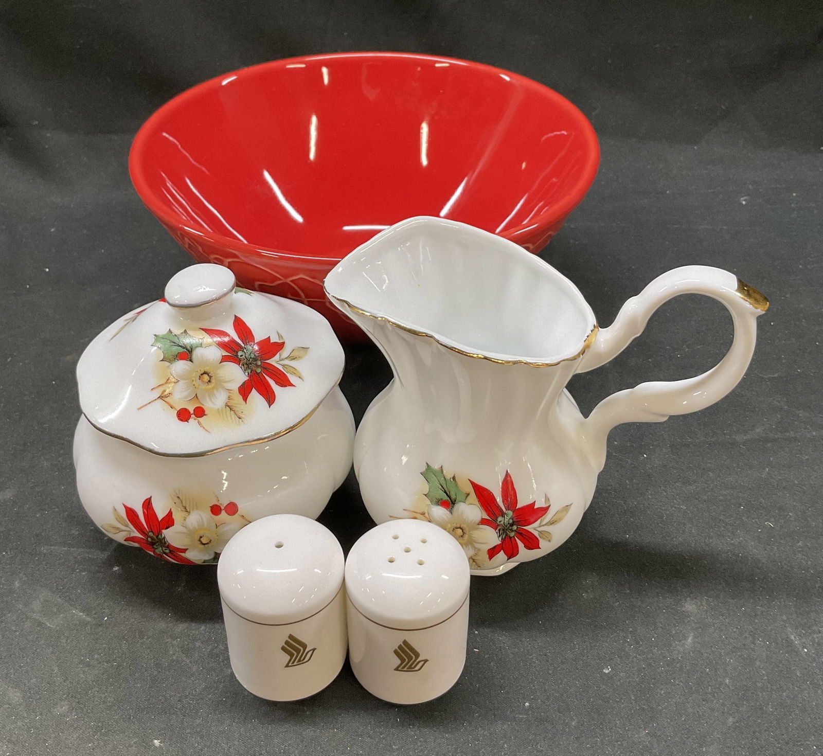 Lot 5 Crmc Dishware, Primagera Portugal & More: Lot includes 1 red glazed ceramic bowl, 2 white bone china salt and pepper shakers, 1 set of mini porcelain Christmas creamer pitcher and sugar jar. Shakers read Singapore Airlines Narumi Bone China J