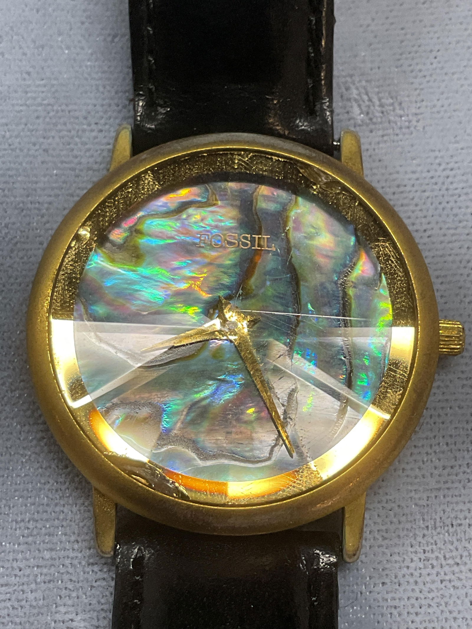 Fossil Gold Tone Abalone Leather Strap Watch: Fossil watch. Abalone dial with gold tone case and black leather strap. Signed. Measures approx 8.5 inches long. Not tested. Some wear including scratching. Jewelry, estate jewelry, costume jewelry, c