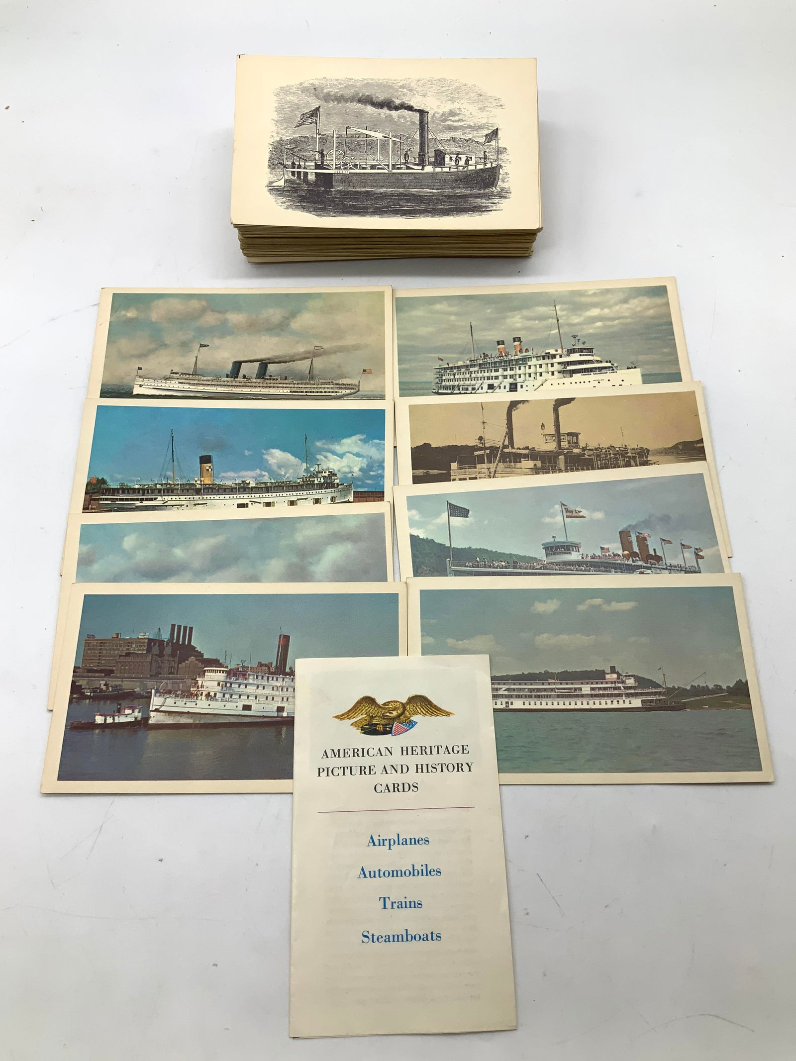 Lot 40+ American Heritage Picture & History Cards: Lot 40+ American Heritage Picture & History Cards Lot includes over 40+ heritage picture & history cards of airplanes, automobiles, trains & steamboats. Cards feature illustrations on one side & under