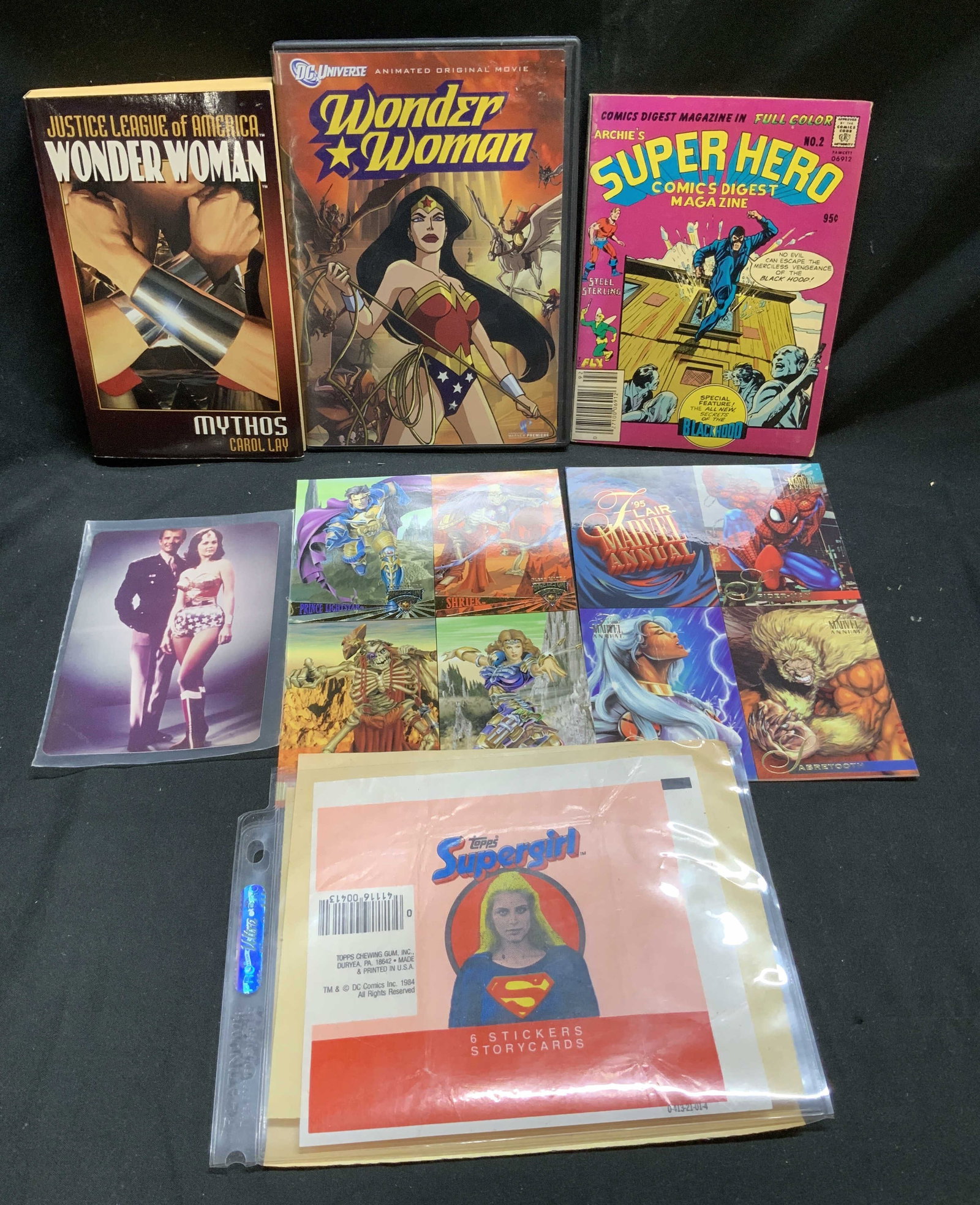 Lot 8 1970-1990s Supergirl & Wonder Woman Collect.: Lot 8 1970-1990s Supergirl & Wonder Woman Collect. Lot includes, 1 photograph of wonder-woman, 1 DC UNIVERSE Wonder Woman movie, 1 Justice League of America Wonder Woman book by Carol Lay. (2003), 1 C