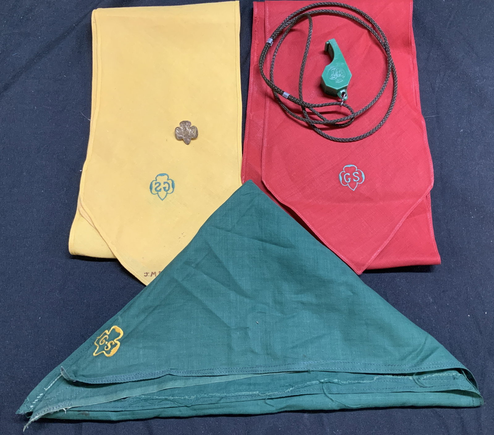 Lot 5 Circa 1940 Girl Scout Sashes, Whistle & Pin: Lot 5 Circa 1940 Girl Scout Sashes, Whistle & Pin Lot includes, 2 Girl Scout sashes with an embroidered GS on ends, 1 green neckerchief, 1 green whistle & 1 Vntg Girl Scout eagle lapel pin. Surface we