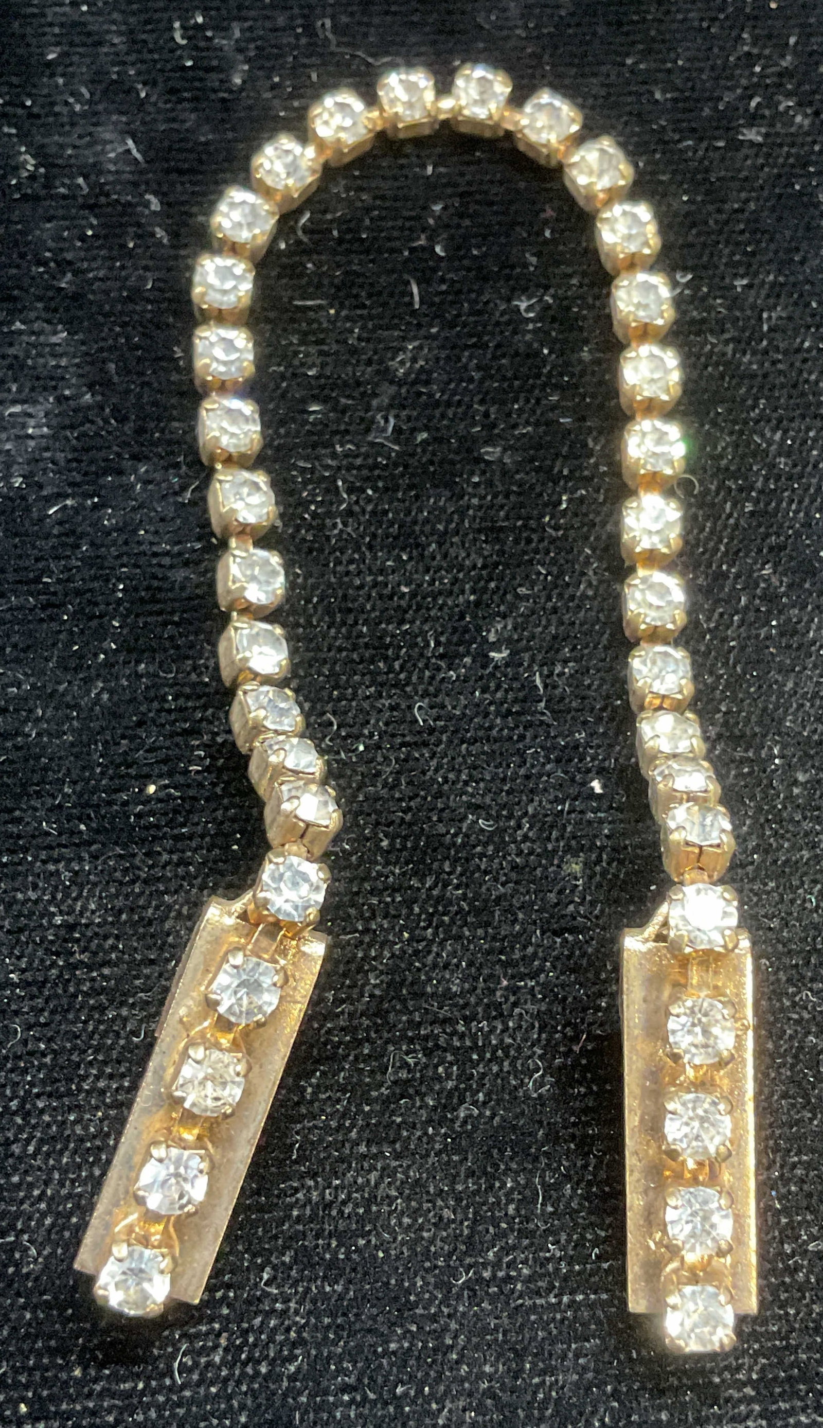Vintage Gold Tone Crystal Sweater Dress Clip: Vintage gold tone and colorless crystal, chain sweater or dress clip. Measures approx 6.75 inches long. Some wear including scratching. Jewelry, estate jewelry, costume jewelry, cocktail jewelry, fash