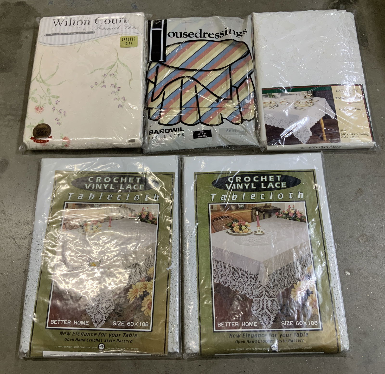 5 Assorted Lace & Crocheted Tablecloths NIP WILTON: 5 Assorted Lace & Crocheted Tablecloths NIP WILTON Lot includes 5 NEW IN PLASTIC tablecloths varying from size & material. Tablecloths have either a lace, linen & crocheted material. Sizes are from ob