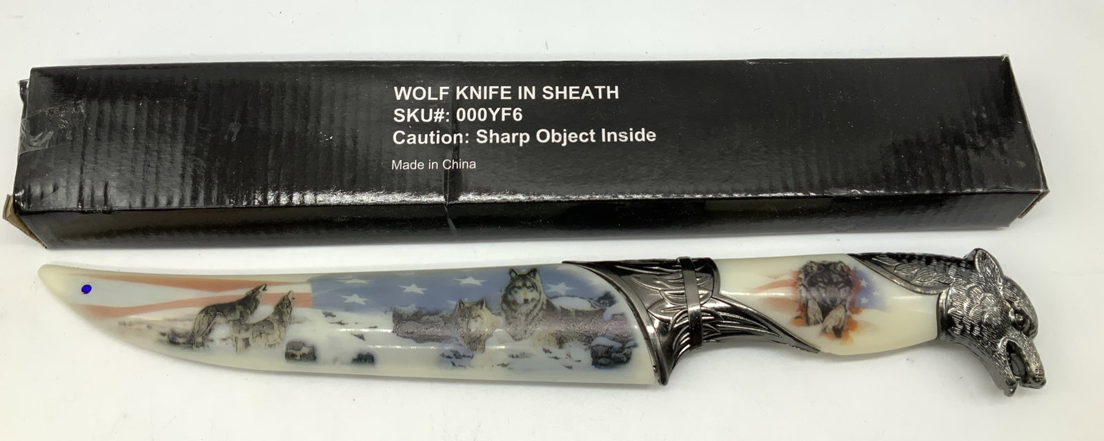 Patriotic Wolf Stainless Steel Knife In Sheath NIB: Patriotic Wolf Stainless Steel Knife In Sheath NIB Knife appears to be stainless steel & features multiple wolfs with an American flag motif in the background. Knife has a sheath. Surface wear consist