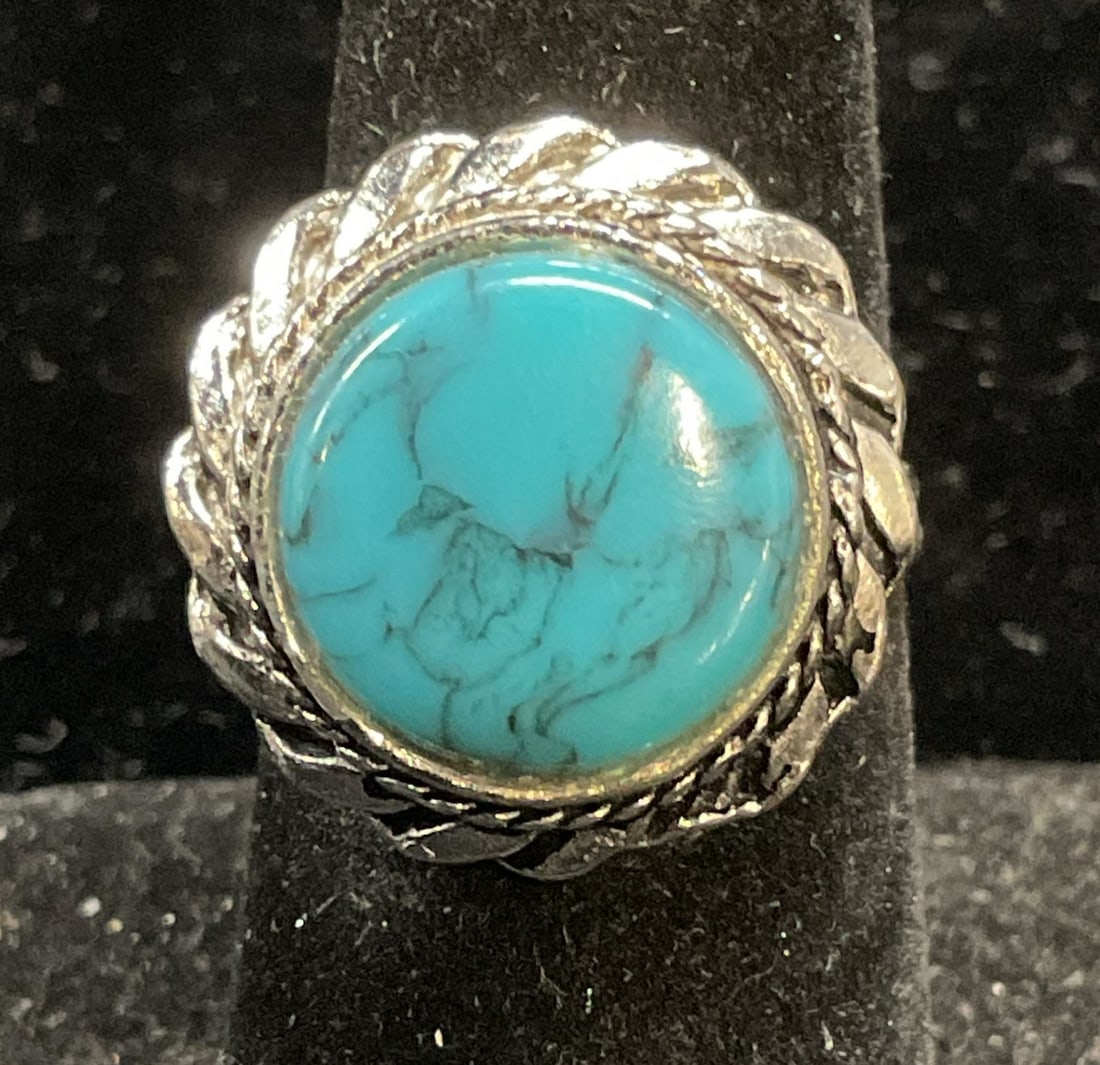 Silver Tone Lucite Turquoise Cocktail Ring: Silver tone cocktail ring with lucite faux turquoise cabochon. Adjustable band. Setting approx .75 inches wide. Some wear including scratching. Jewelry, estate jewelry, costume jewelry, cocktail jewel