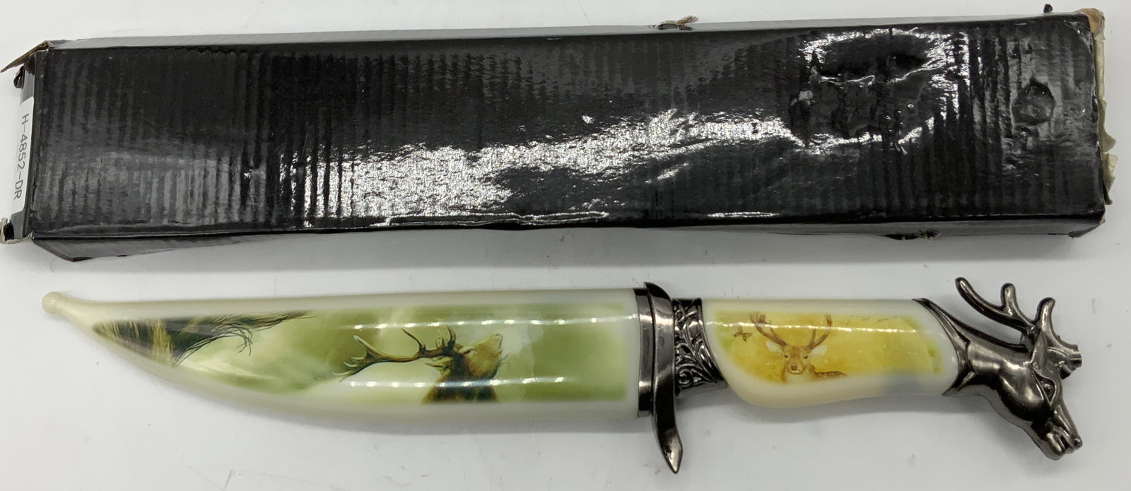 Wildlife Collection Deer Motif Stainless Knife: Wildlife Collection Deer Motif Stainless Knife Knife is stainless steel & is part of the Wildlife collection series. Knife features deer motif images. Comes with original box. Surface wear consistent 