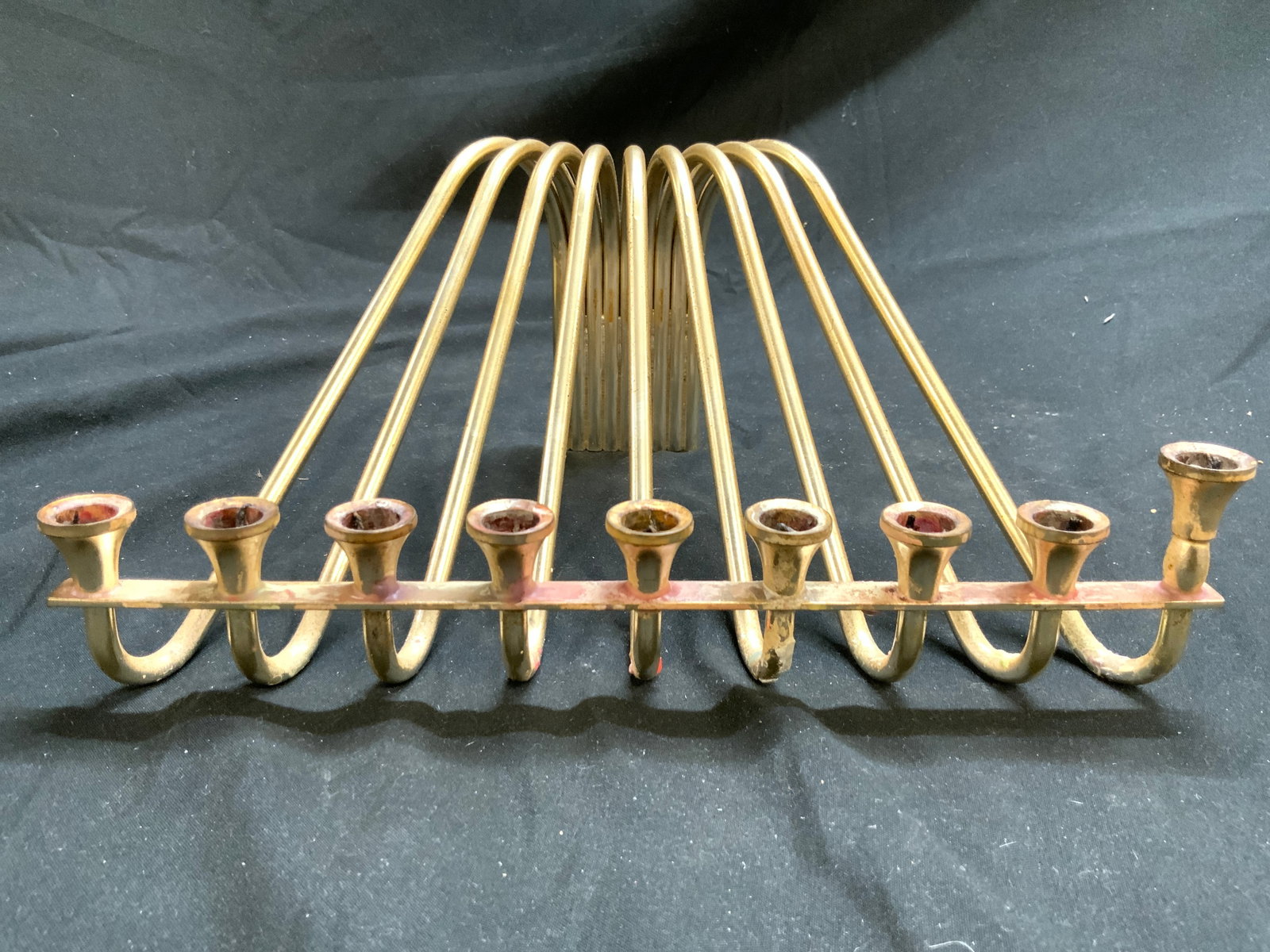 Karshi Vintage Gold Plated Menorah Judaica: Menorah appears to be KARSHI (No apparent markings). Menorah is vintage. Piece is gold plated. Menorah structure has s form arms. Piece has 9 candle areas. Measures approximately 7.5 inches deep 10 in