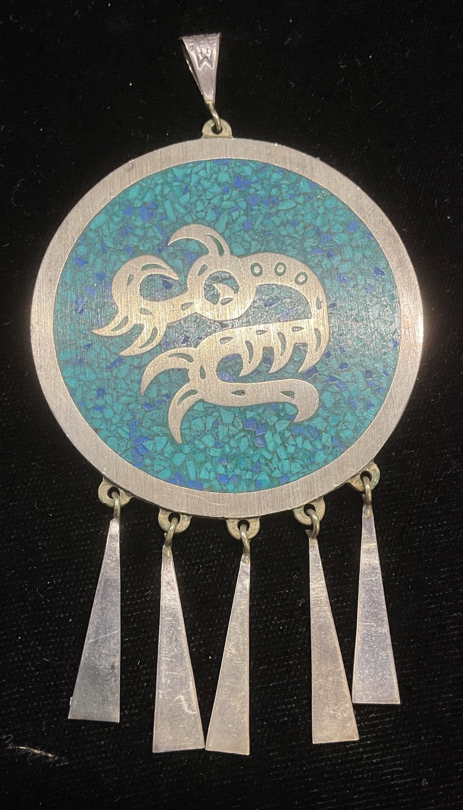Sterling Silver Turquoise & Jet Pendant Mexico: Sterling silver double sided round pendant with inlaid turquoise and black jet. Traditional Mexican animal and geometric motifs. Marked sterling. Made in Mexico. Measures approx 3.5 x 2.25 inches. Tot