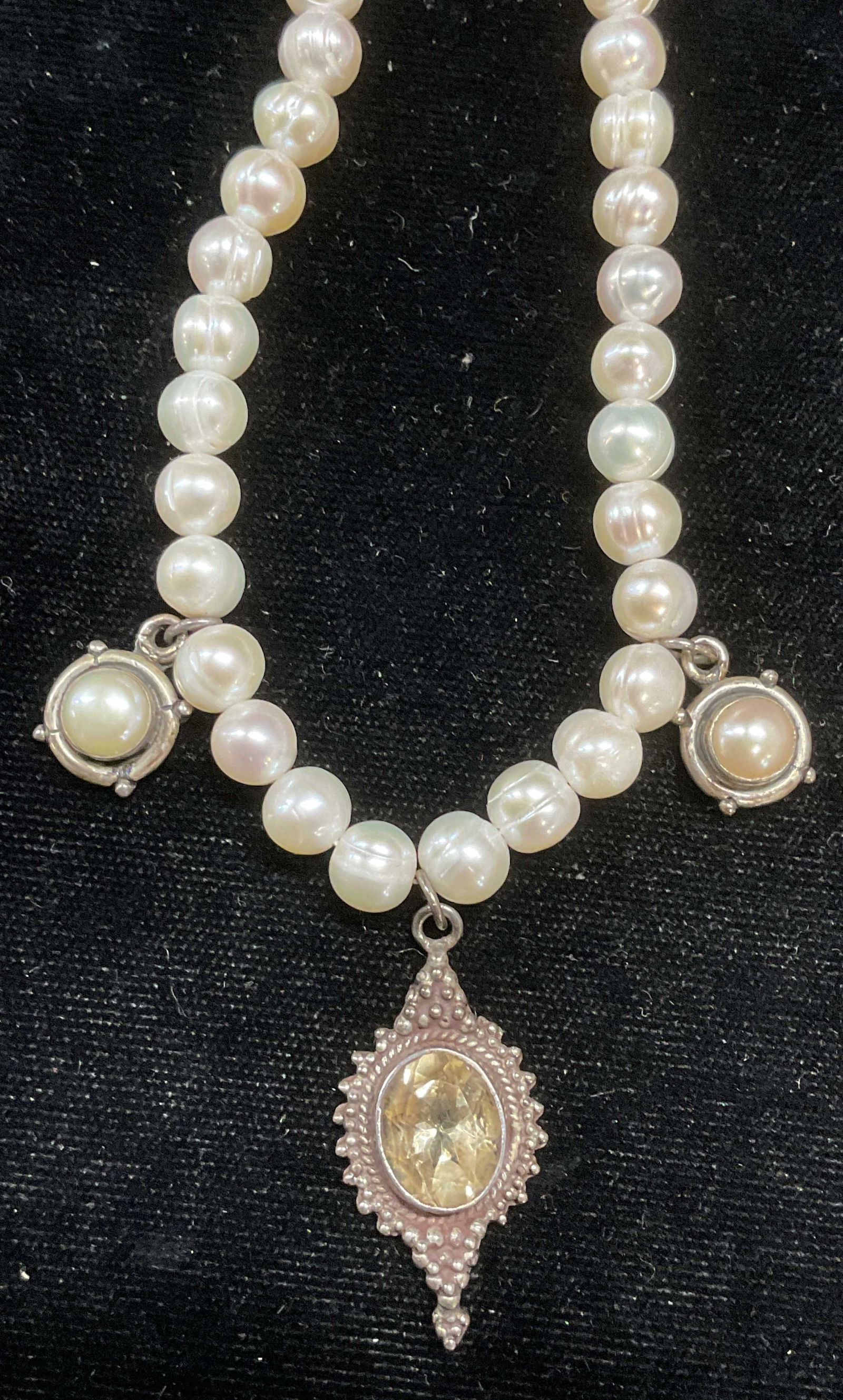 Vintage Sterling Silver Pearl Citrine Necklace: Vintage pearl necklace with sterling silver pendants and clasp. Pearl and citrine semiprecious pendants. Marked sterling. Drop length approx 8 inches. Total weight 31.9 grams. Some wear including scra