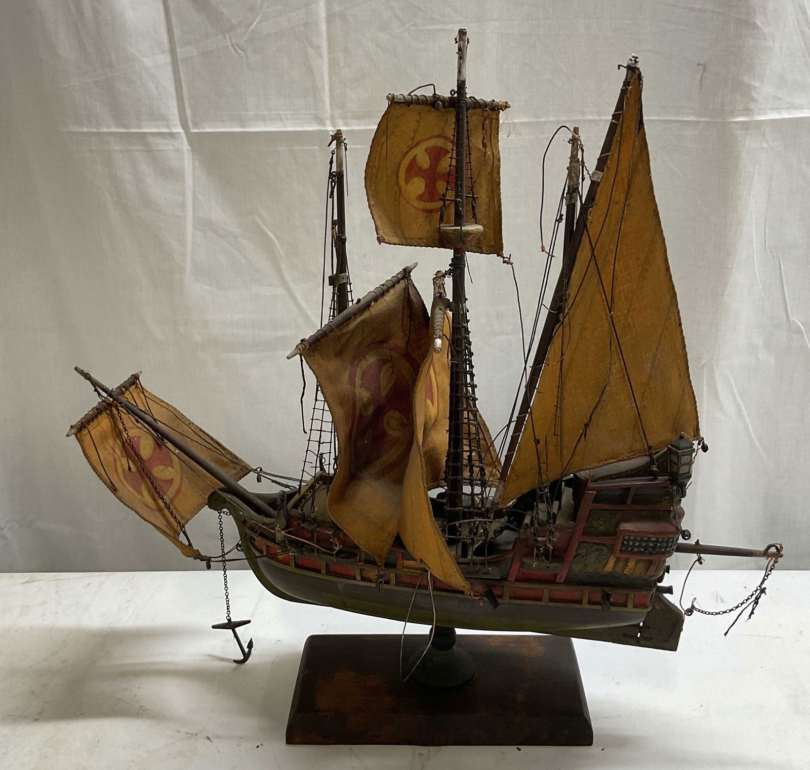 Atq Hand Crafted Wooden Red Cross Model Ship: Antique hand crafted wooden Red Cross model ship. Historical vessel with Circular Red Cross symbol on sails. Shoe shaped hull, metal masts, and wooden toggles. Signs of age present including loose pie