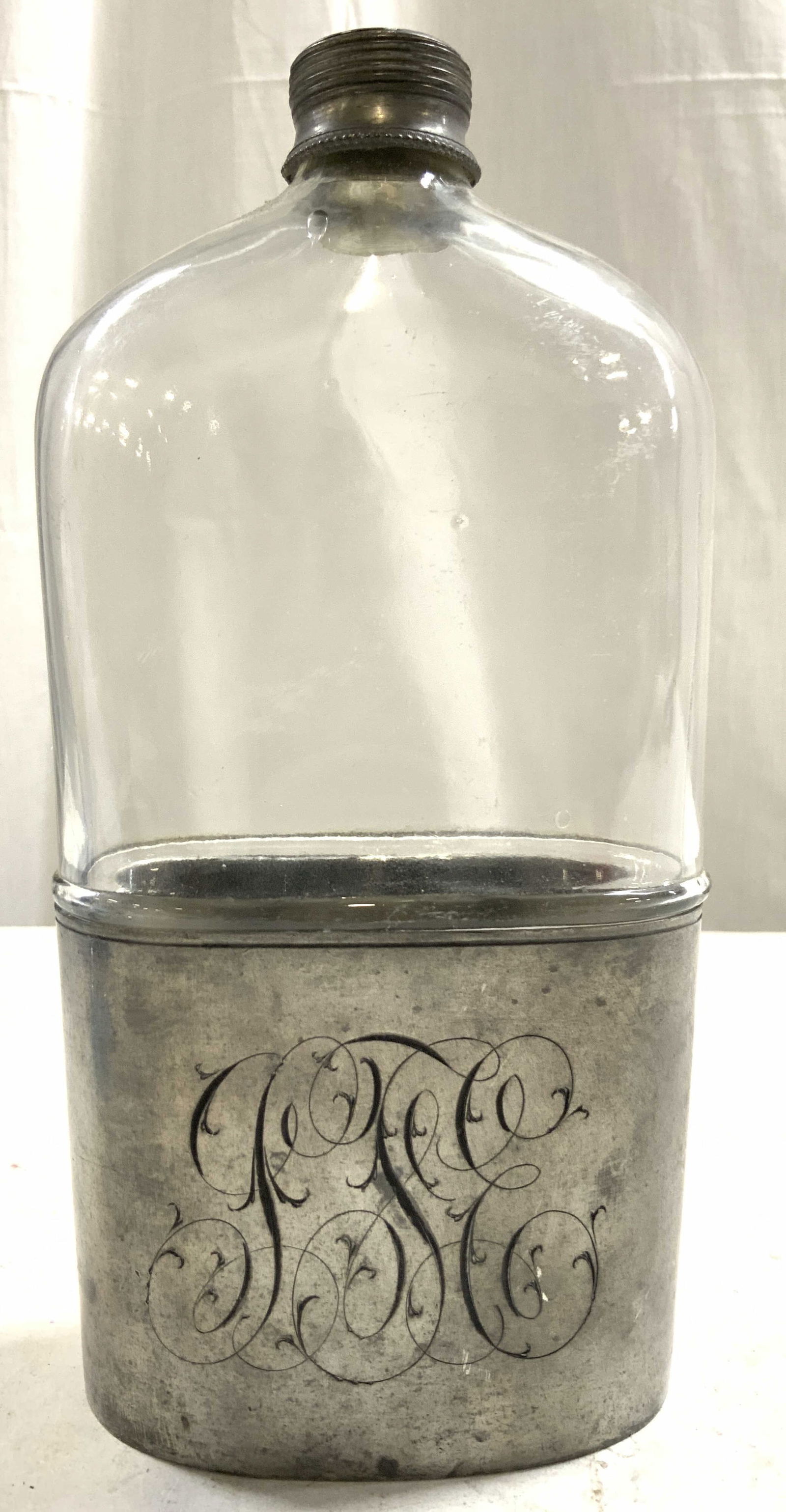MV OLRY Vtg Mngrm Pewter & Glass Flask Phil PA: Underside of glass trademarked MV OLRY PHILA PA (Philadelphia Pennsylvania). Pewter cover is Monogrammed (appears to read (STE). Flask is glass with lower half pewter cover. Top of piece has silver to