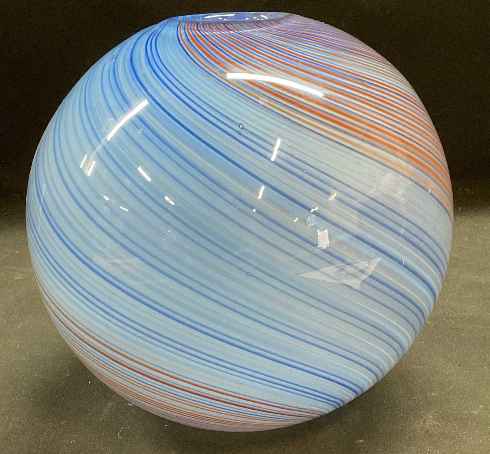 Hand Blown Blue Swirl Art Glass Vase: Hand blown art glass vase. Sphere shaped. Cased glass with blue and orange swirl design. Style of DANSK, no visible signature or marks. Measures approx 7.5 x 7 inches. Piece has weight. Some wear incl