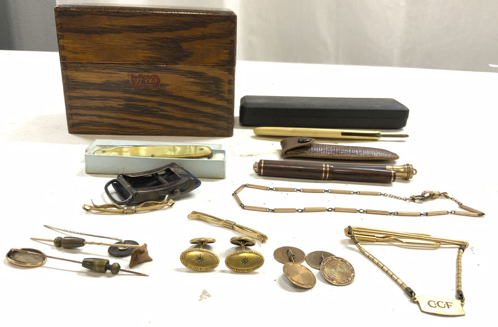 Lot12 Jewelry, Sterling, Urhan Uplex Bakelite+: Lot accessories and jewelry includes 1 sterling silver belt buckle monogrammed CCF inscription on backside read STERLING weight approximately .77 OZT, 1 URHAN UPLEX Bakelite handle switch blade with b