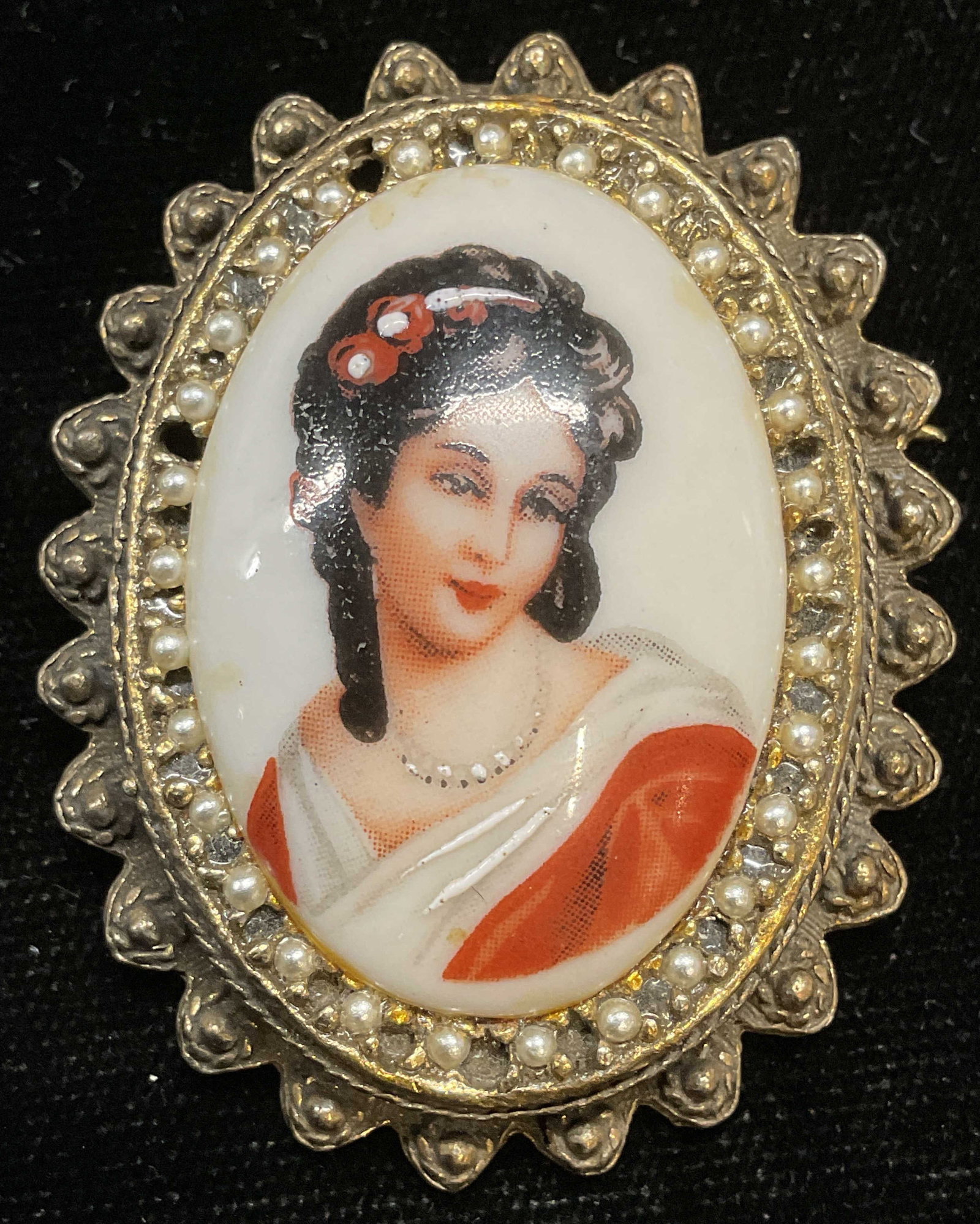 Limoges Porcelain Seed Pearl Brooch France: Vintage Limoges porcelain brooch with woman portrait print and gold tone frame with seed pearls. Signed. Made in France. Measures approx 1.75 x 1.5 inches. Some scratching. Some pearls need replacemen