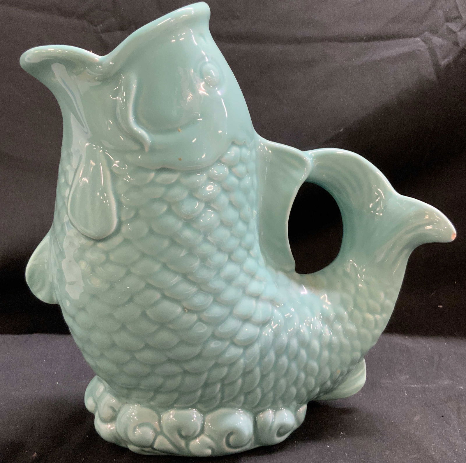 NANTUCKET HOME Fish Gluggle Ceramic Jug: NANTUCKET HOME Fish Gluggle Ceramic Jug Ceramic gluggle jug featuring a textured fish. Fish is wide mouthed & features a fish scale design. Signed & marked on underside. Reads, NANTUCKET HOME. Surface