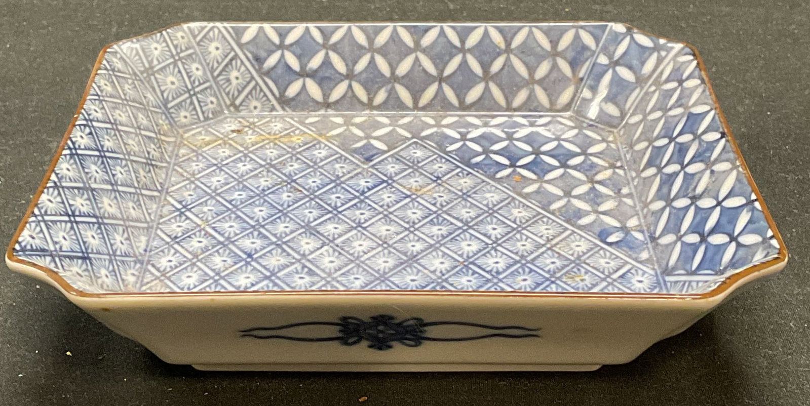 Signed Chinese Porcelain Blue & White Dish: Signed Chinese porcelain dish in blue and white with geometric floral pattern. Signed on underside. Measures approx 6 x 6 x 1.25 inches. Some wear including scratching observed. Porcelain dish, Chines