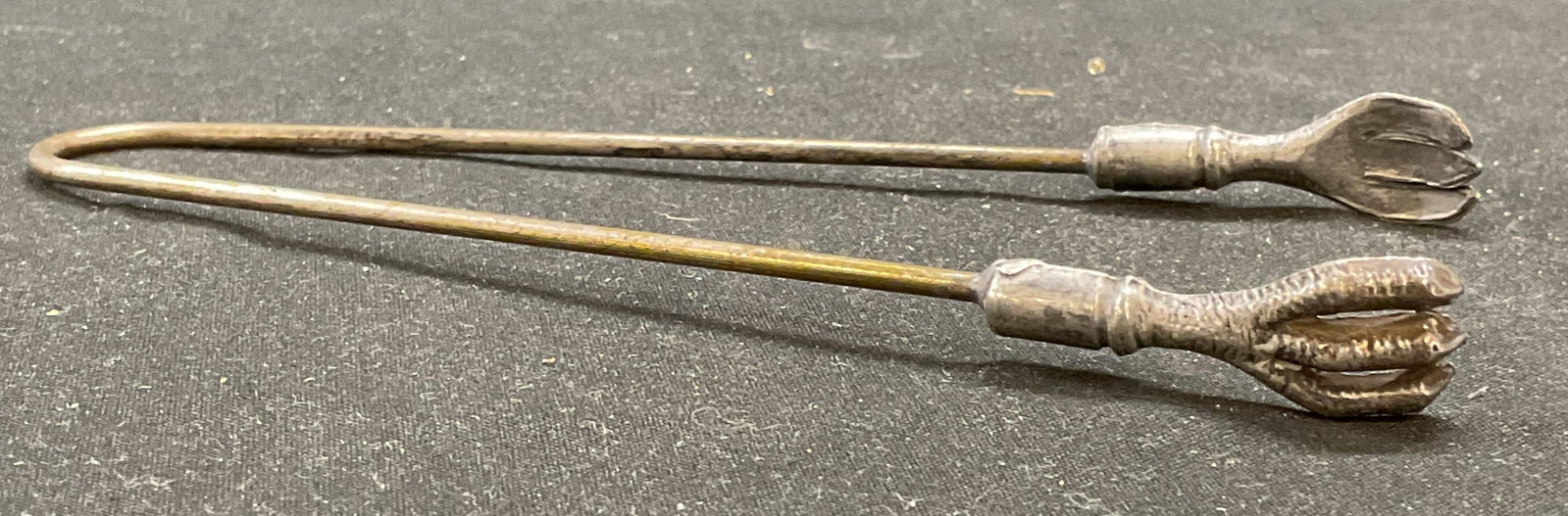 Vintage Silver Tone Claw Talon Pickle Tongs: Vintage silver tone pickle tongs with claw talon motif. Measure approx 5.5 inches long. Wear including scratching and patina. Tongs, vintage tongs, pickle tongs, claw tongs, talon tongs, tableware, ta
