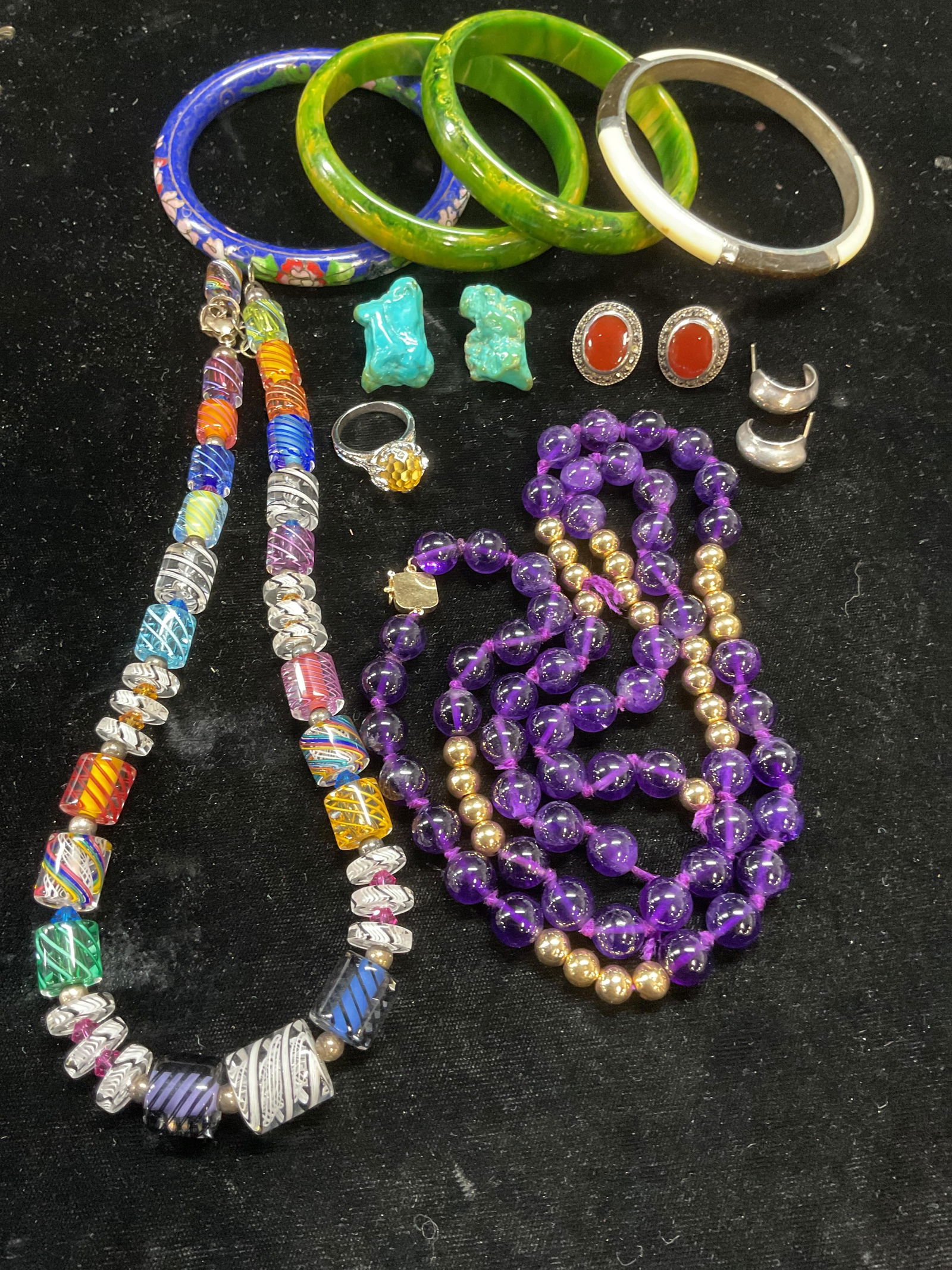 10 Jewelry 14k Gold, Sterling Silver, Art Glass: Lot of 10 pieces. 14k gold and amethyst beaded necklaces. Marked 14k. Needs to be restrung. Total weight 81 grams. Sterling silver semiprecious stone ring, size 6. Sterling silver carnelian and Marcas