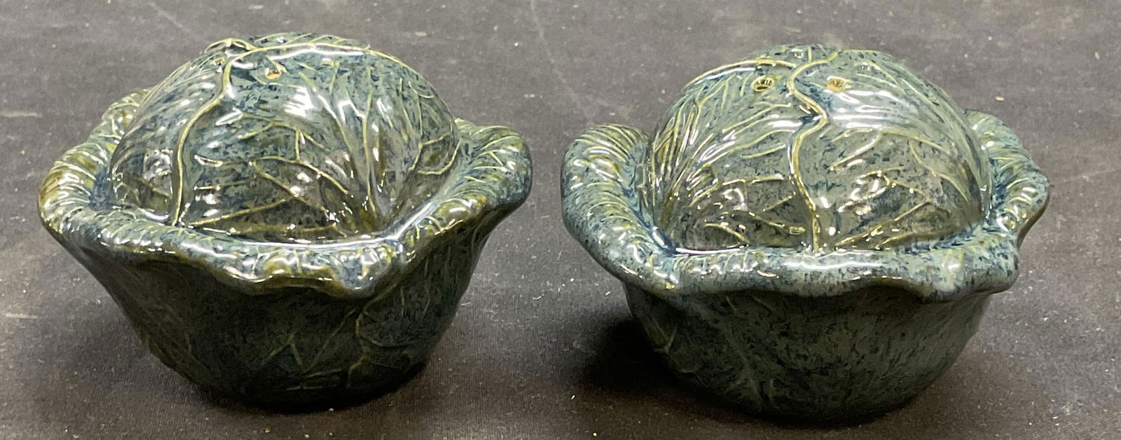 Vtg Pair HM Blue Cabbage Salt & Pepper Shakers: Pair of vintage HM ceramic cabbage motif salt and pepper shakers in blue. Signed. Measure approx 3 x 2.25 inches. Some surface wear consistent with exposure. Salt and pepper shakes, ceramic salt and p