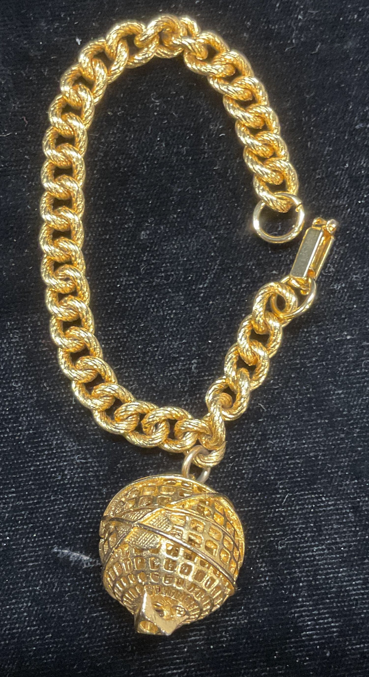 Vintage Gold Tone Globe Charm Bracelet: Vintage gold tone bracelet with globe motif charm. Measures approx 6.75 inches long. Some scratches observed. Jewelry, estate jewelry, costume jewelry, cocktail jewelry, fashion jewelry, accessories, 