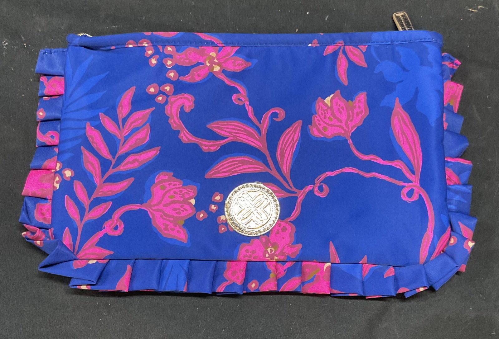 Blue & Pink Floral Ruffle Zippered Pouch NWOT: Blue and pink floral print zippered pouch with ruffled trim. Gold tone hardware. Polyester blend. New without tag. Measure approx 6.5 x 10.5 inches. Zippered pouch, blue pouch, pink pouch, floral pouc
