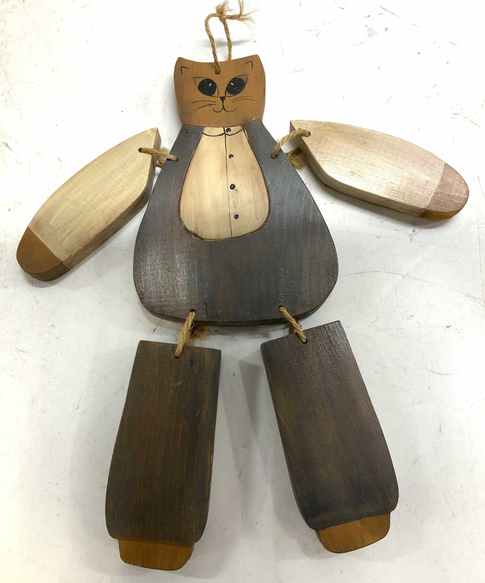 Folk Art Wooden Articulated Country Cat Fig.: Hand-carved and painted wooden cat figure with jointed limbs. Cat limbs are attached to twine. Surface wear consistent to age, use & exposure. Measurements: length 5.2in x width 0.6in x height 13in. C