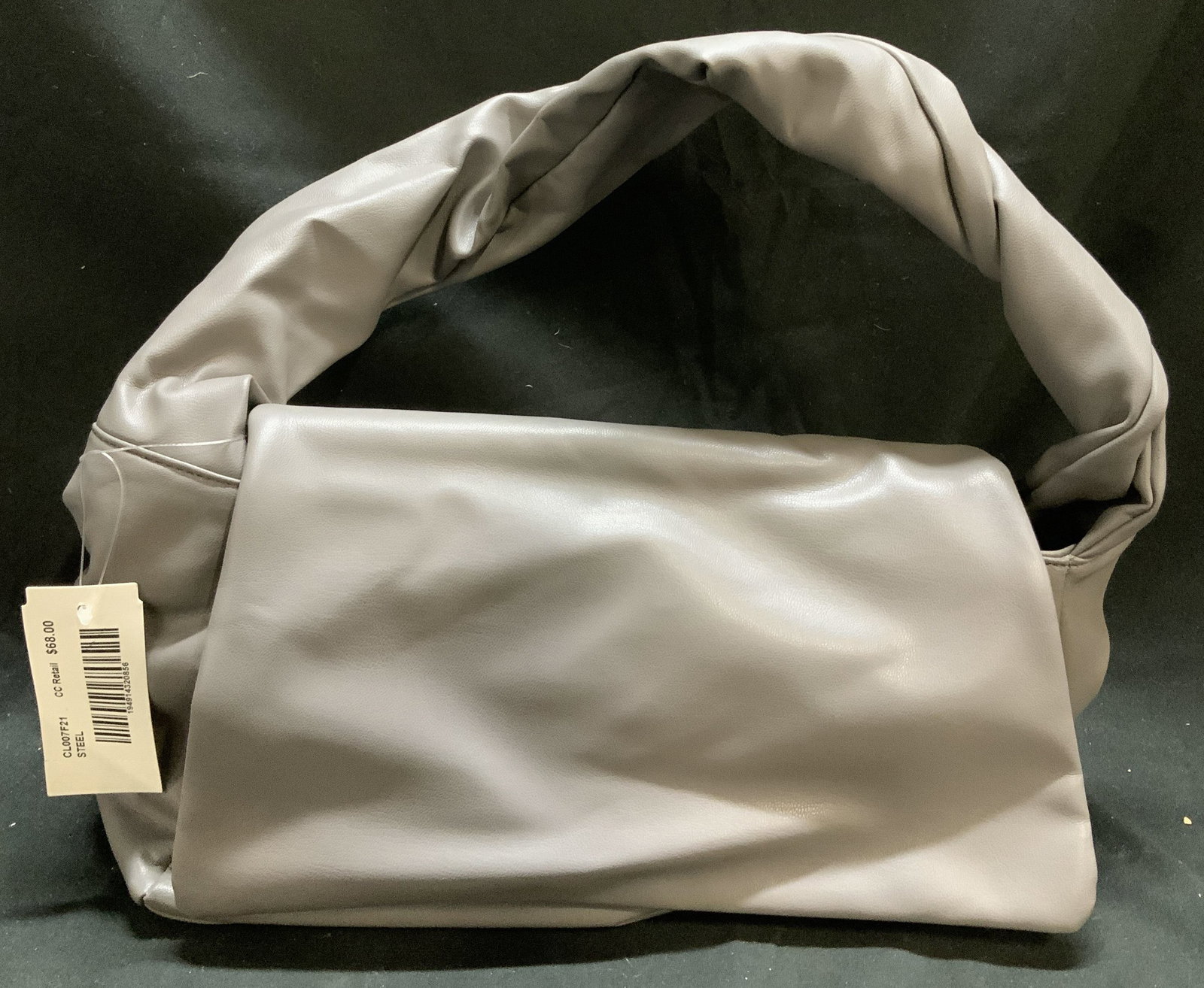 Grey Faux Leather Fold Over Handbag NWT: Grey Faux Leather Fold Over Handbag NWT Grey faux leather handbag with fold over flap. Interior pocket with ample space. Surface wear consistent to age, use & exposure. Measurements: length 12in x wid