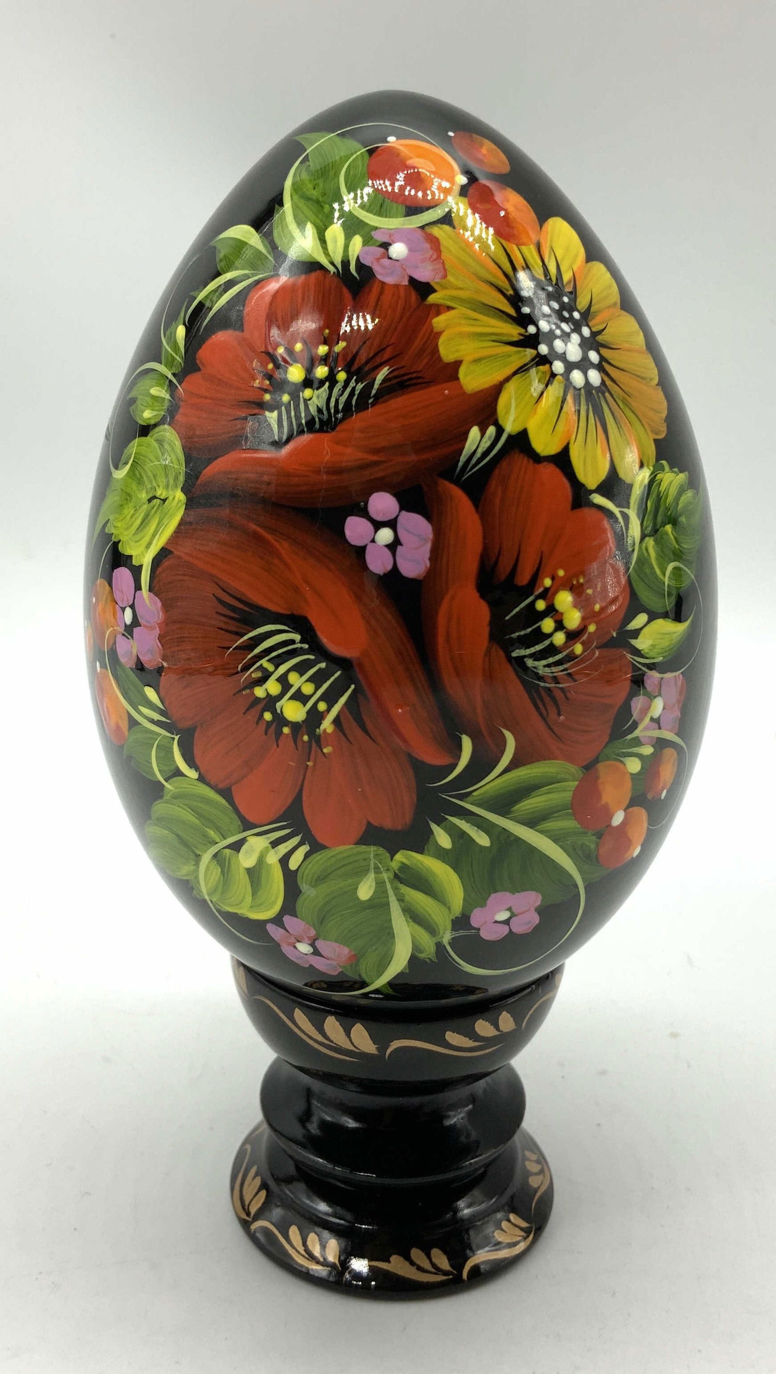Hand Painted Lacquered Pysanka Wooden Egg UKRAINE: Hand Painted Lacquered Pysanka Wooden Egg UKRAINE Wooden egg features hand-painted floral motifs & a wooden pedestal/raised stand. Signed & marked. Reads, HAND MADE IN UKRAINE. Surface wear consistent