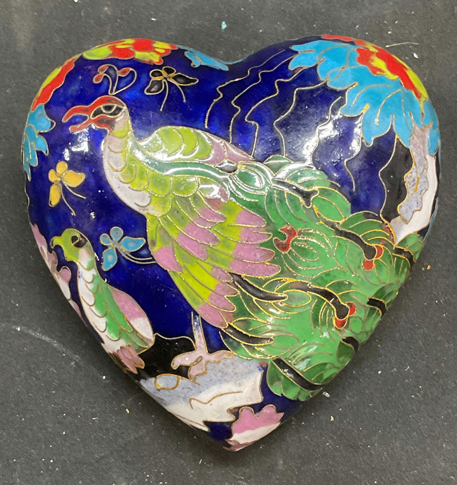 Cloisonne Enamel Heart Peacock Paperweight: Cloisonne enameled metal heart shaped paperweight with peacock motif. Hand decorated. Measures approx 4 x 4 inches. Some scratching. Cloisonne paperweight, enamel paperweight, heart paperweight, peaco