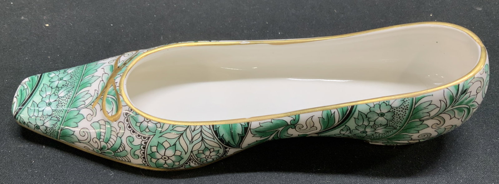 Vntg Green Chintz Porcelain Lady Shoe ITALY: Vntg Green Chintz Porcelain Lady Shoe ITALY Porcelain lady shoe features a green chintz/paisley pattern with gold accents. Marked on underside. Reads, 5.6672 ITALY. Surface wear consistent to age, use