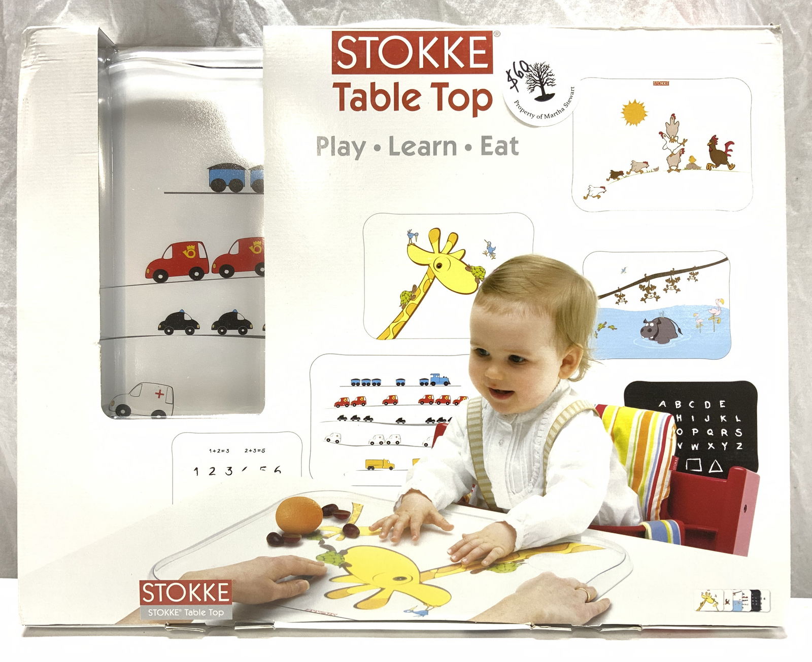 STOKKE Childrens Tabletop Tray: Box reads STOKKE TABLE TOP. Tray has various inserts with illustrations. Box measures approx 19.5 inches long 15.5 inches wide. Box has damage including tears. Tray, tabletop tray, stokke, stokke tabl