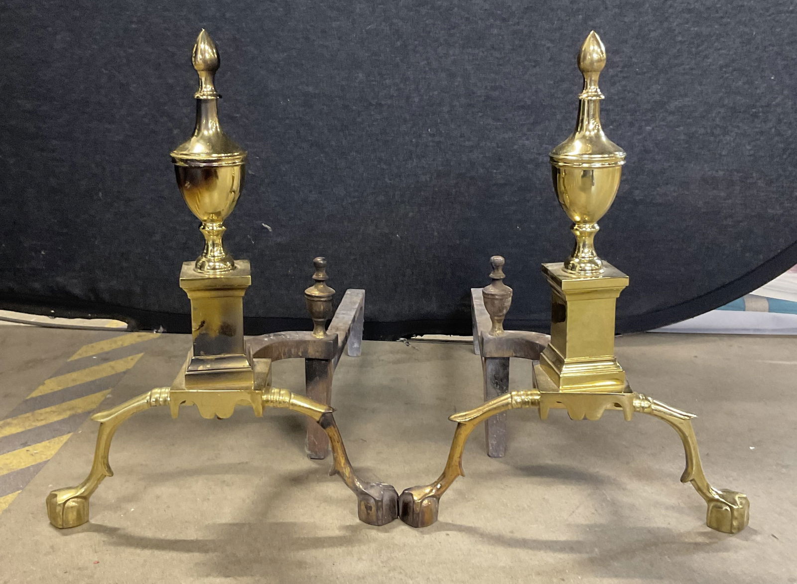 Pair Vintage Brass Claw & Ball Feet Andirons: Pair Vintage Brass Claw & Ball Feet Andirons. Crafted from brass and iron. Measures approx. 21D x 13W x 18H in. Loose pieces, discoloration, and surface wear present. home decor, home accents, homewar