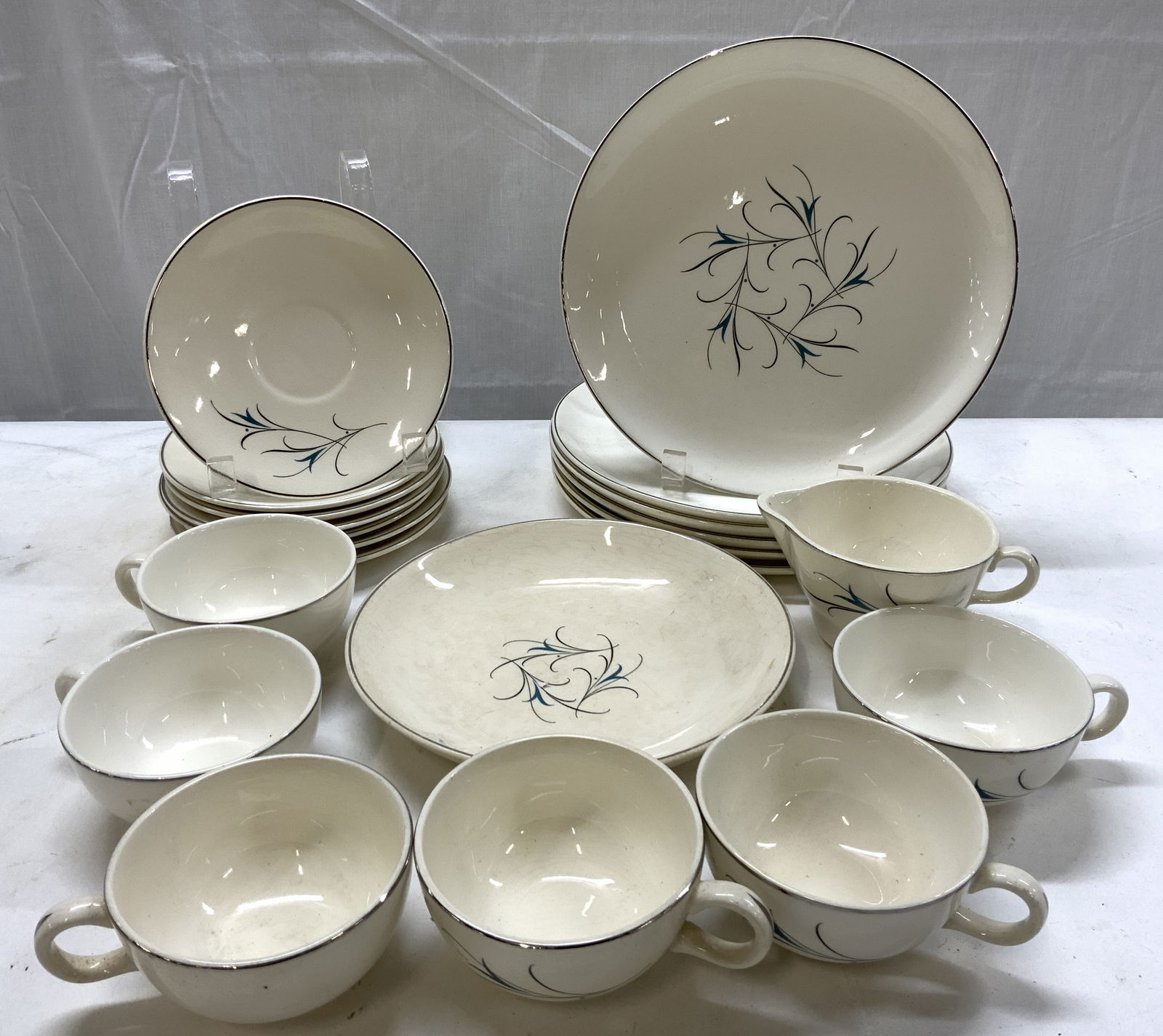 SALEM Simplicity Turquoise&Black Flowers Tableware: SALEM Simplicity Turquoise&Black Flowers Tableware 6 cups, 1 creamer, 7 saucer plates, 1 bowl & 6 dinner plates. Each piece has turquoise flowers with black stems. Reads SALEM. Surface wear consistent