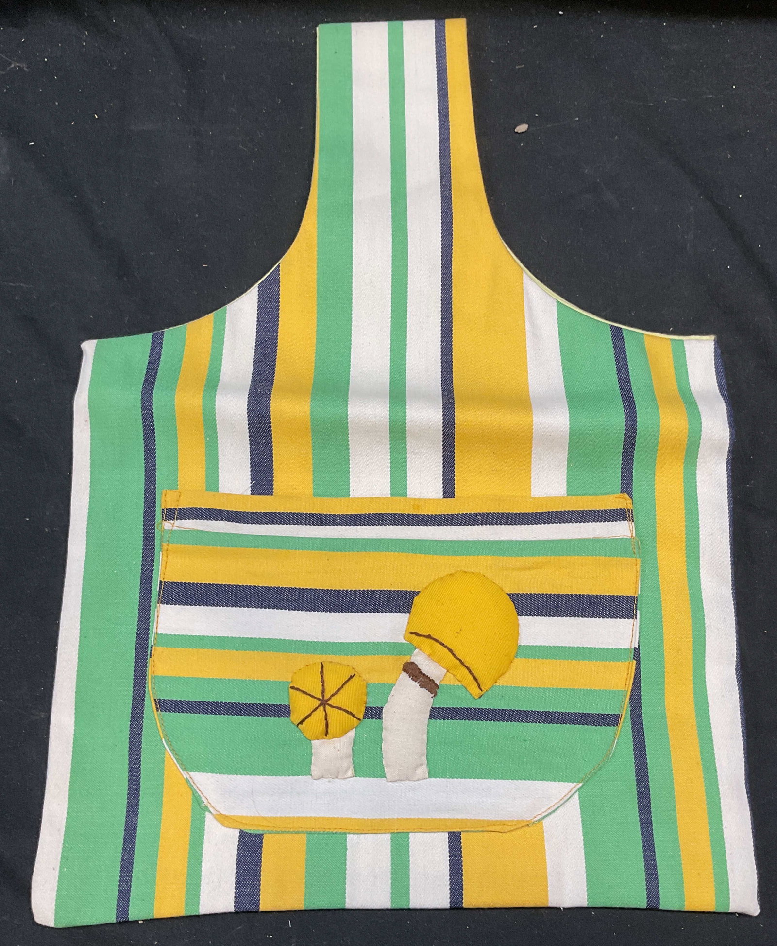 Vtg Handmade Green Stripe Mushroom Handbag: Vintage handbag cotton handbag with green, white, yellow, and blue stripe pattern and mushroom motif applique. Exterior and interior pocket. Measures approx 11 x 12 inches excluding strap. Some wear c