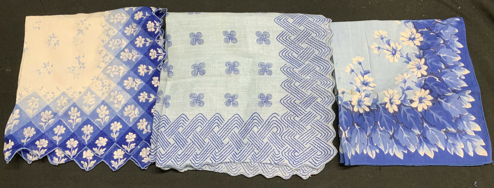 3 Vtg Blue Floral & Geometric Linen Handkerchiefs: Lot 3 Vtg Blue Floral & Geometric Linen Handkerchiefs 2 handkerchiefs featuring a border of blue and white floral patterns & 1 featuring geometric motifs. Appear to be possible linen material. Surface