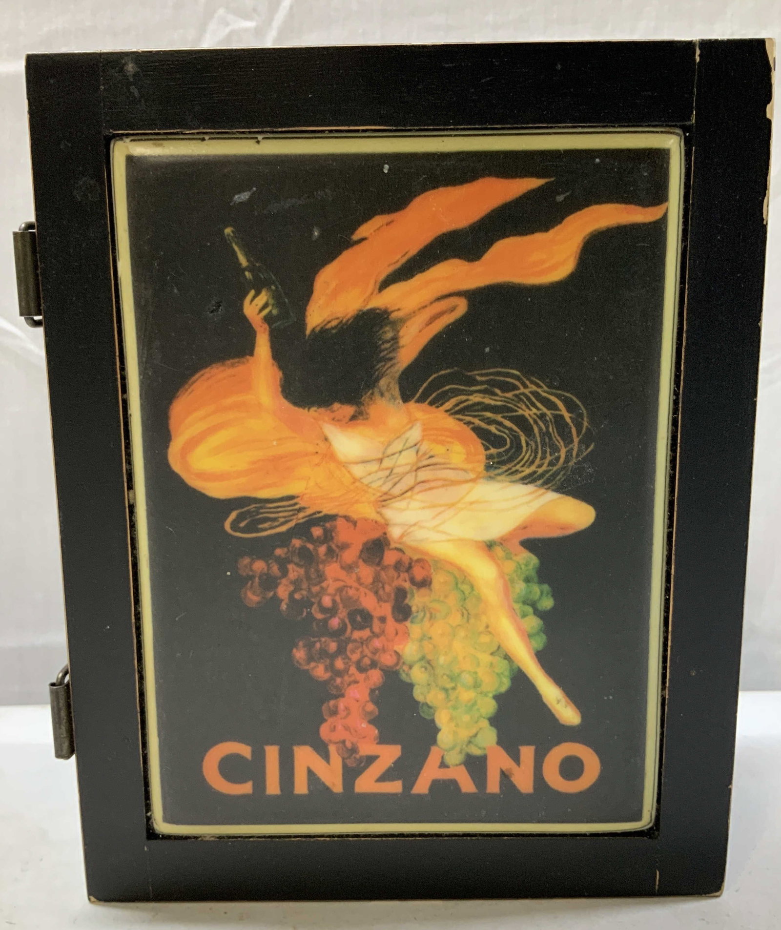 Cinzano Wooden Wine Bottle Advertisement Box: Cinzano Wooden Wine Bottle Advertisement Box Wooden box features a stylized, woman figure holding a wine bottle. Woman is surrounded by grapes in varying shades of red, orange, and green. Surface wear