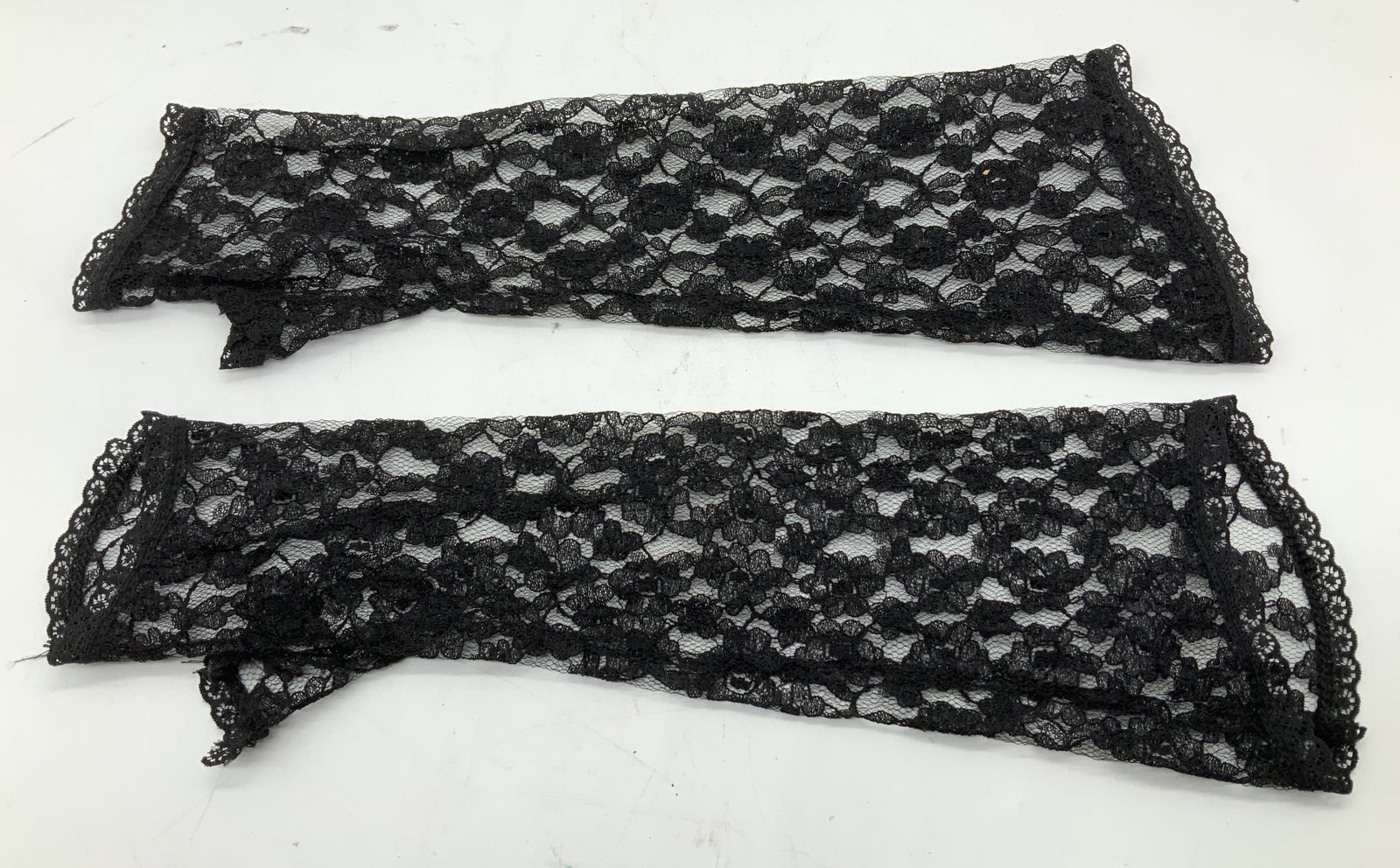 Vntg Embroidered Floral Lace Opera Gloves: Vntg Embroidered Floral Lace Opera Gloves Pair of black lace fingerless gloves. They feature an intricate lace floral pattern. Surface wear consistent to age, use & exposure. Measurements: length 14.5