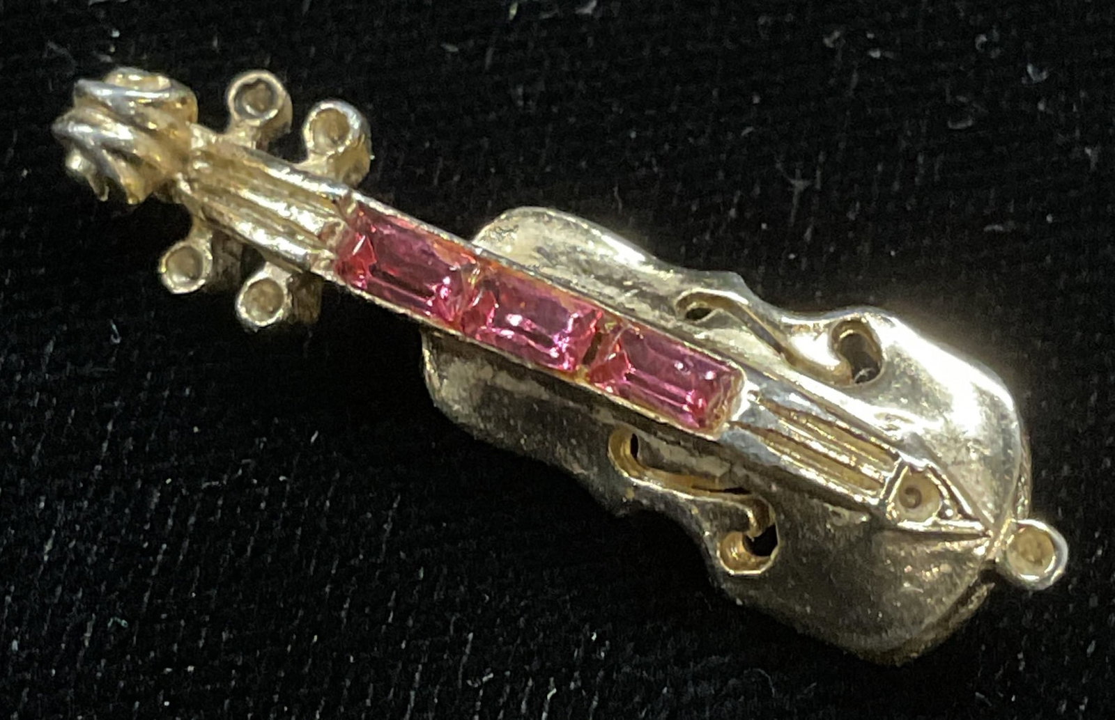 Vintage Gold Tone Crystal Violin Brooch: Vintage gold tone pink crystal violin motif brooch. Measures approx 1.25 x 3/8 inches. Some scratching observed. Jewelry, estate jewelry, costume jewelry, cocktail jewelry, accessories, fashion access
