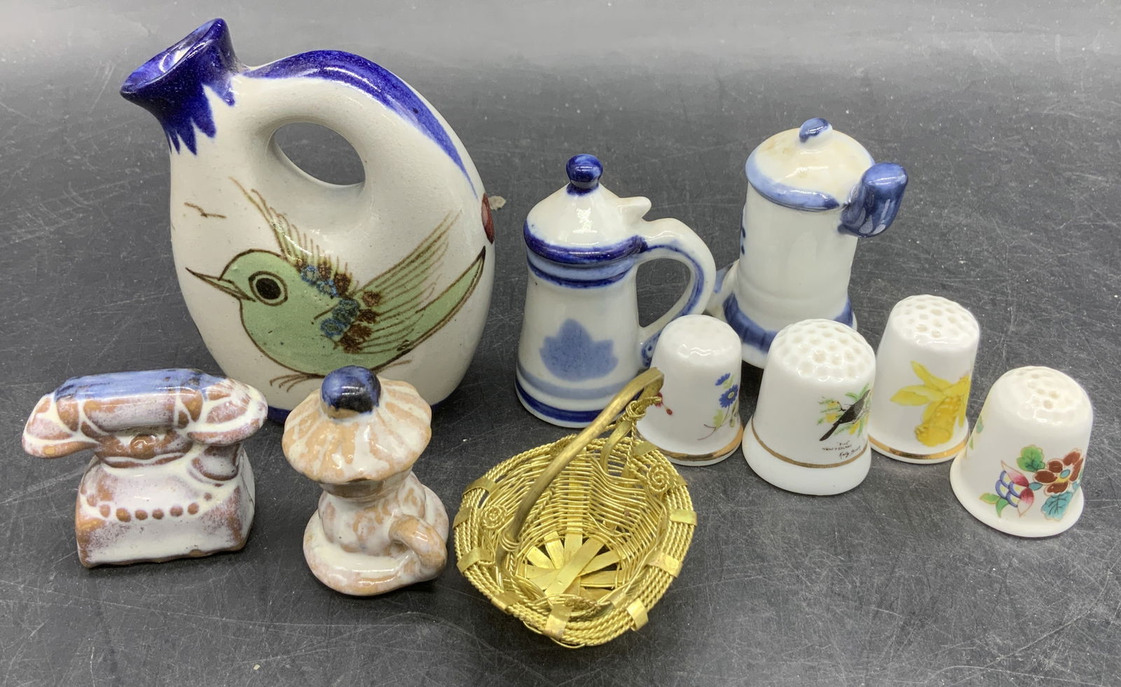 10 Vtg Ceramic & Porc Figs, England, Mexico, Japan: Lot 10 Vtg Ceramic & Porc Miniature Figs. MEXICO Lot includes, mini bird motif vase, ceramic telephone, porcelain windmill fig, mini woven gold toned basket, porcelain teapot, 4 porcelain floral thimb