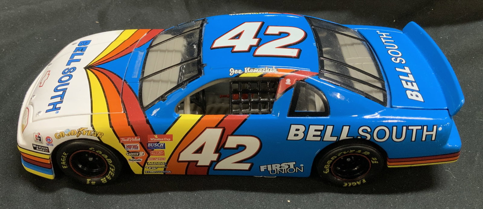 NASCAR Joe Nemechek #42 1:24 Die-Cast Metal Car: NASCAR Joe Nemechek #42 1:24 Die-Cast Metal Car 1:24 scale die-cast replica of Joe Nemecheks #42 Bellsouth Chevrolet NACAR metal car. Car features sponsor logos including, SIMPSON, WINSTON CUP, BOWMAN