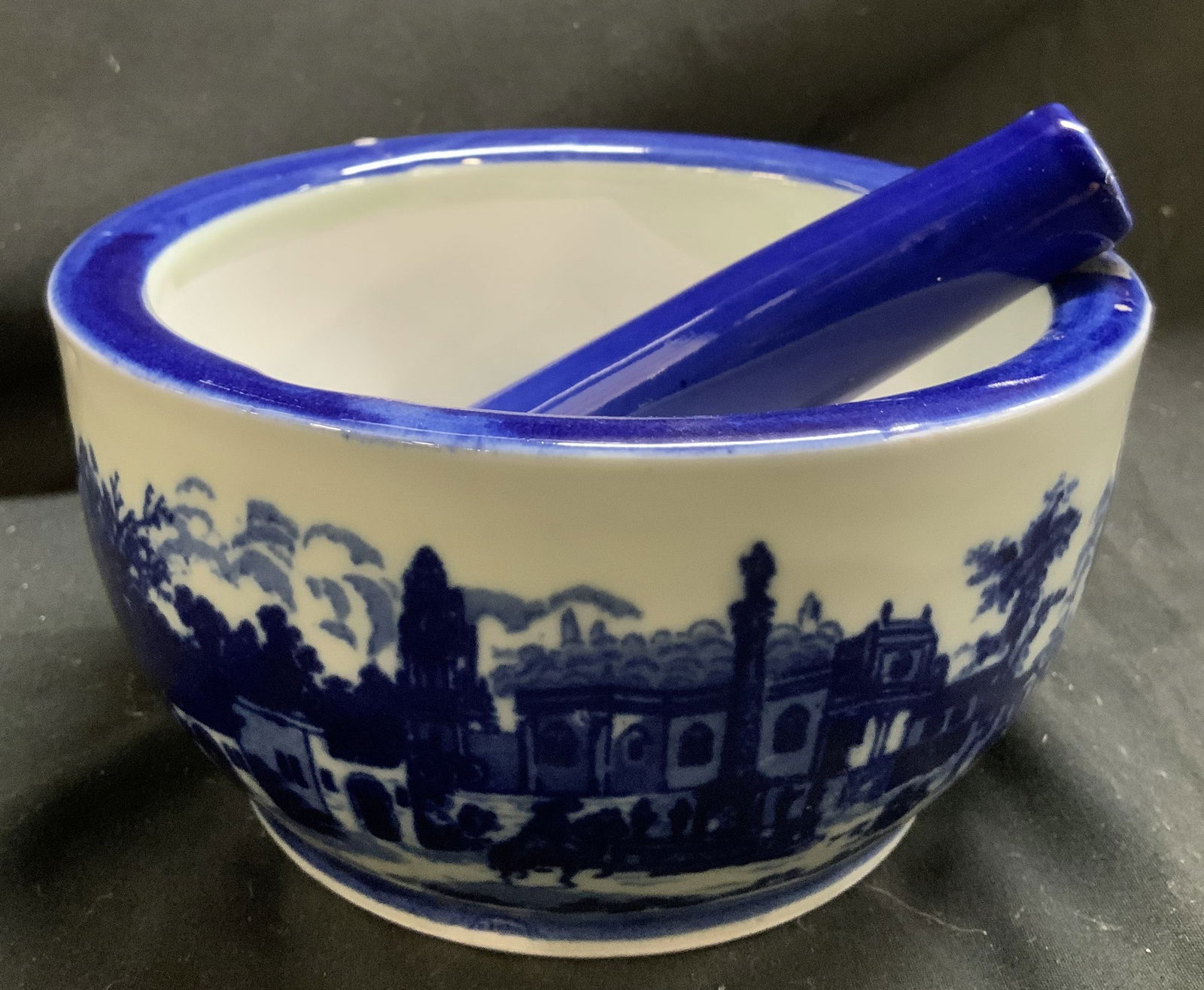 Vntg Victoria Scenic Ironstone Mortar & Pestle: Vntg Victoria Scenic Ironstone Mortar & Pestle Mortar & pestle feature a blue Victorian scenic design. Deigns features buildings, people & horses. Ironstone material. Signed & marked. Reads, VICTORIA
