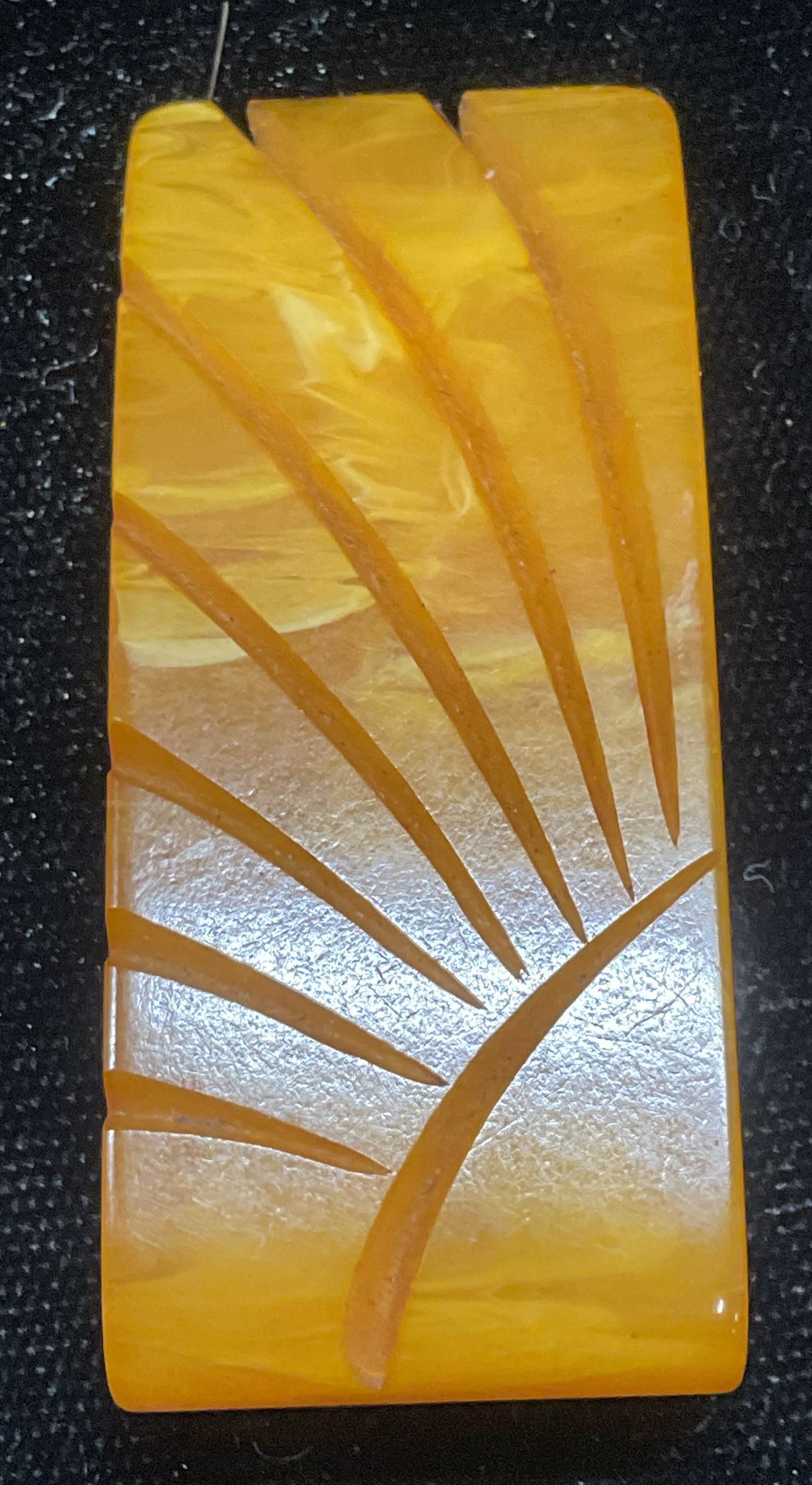 Vintage Amber Lucite Carved Flower Fur Clip: Vintage faux amber lucite carved flower or sun motif fur clip. Measures approx 2 x 7/8 inches. Some wear including scratching. Jewelry, estate jewelry, costume jewelry, cocktail jewelry, fashion jewel