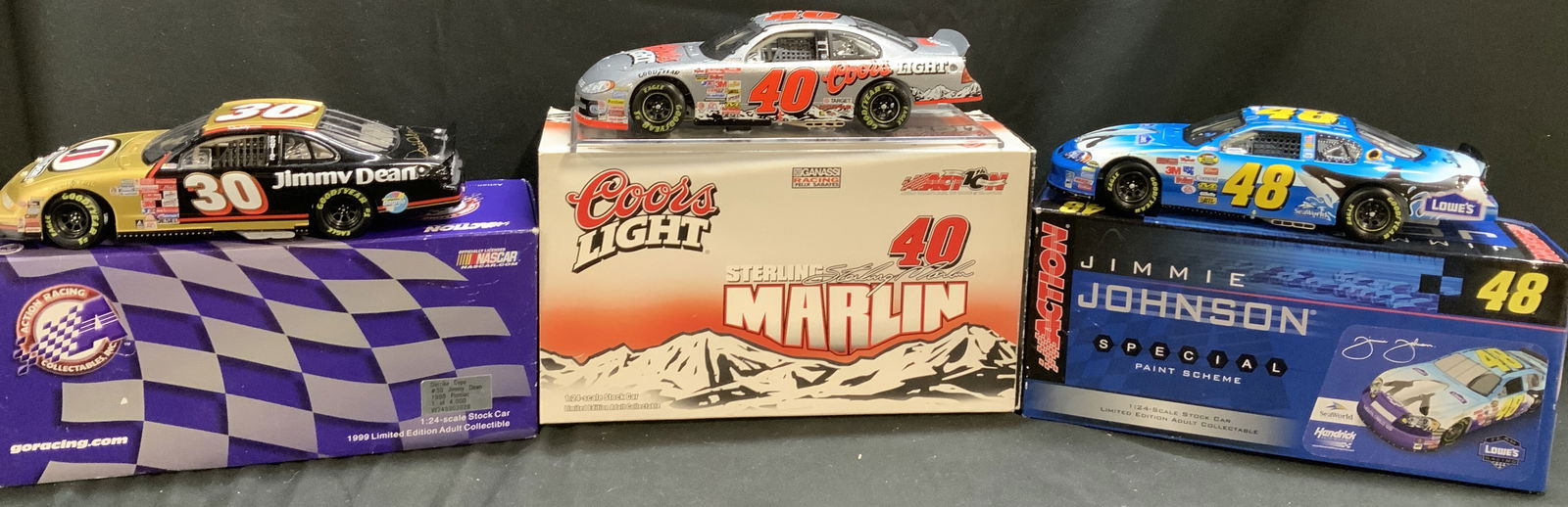 Lot 3 NASCAR Assorted 1:24 Die-Cast Metal Cars: Lot includes, Jimmie Johnson #48 LOWES car, Derrike Cope #30 Jimmie Dean & Sterling Marlin #40 Coors Light. Cars come in original box & feature sponsor logos. Logos including, NASCAR, JESEL, BUD, 3M &